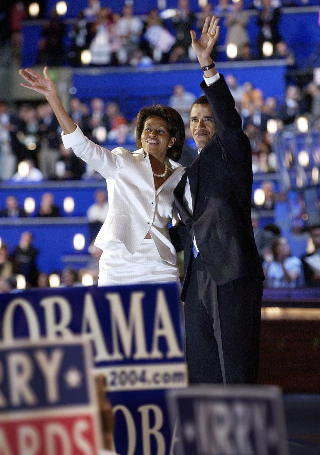 Michelle and Barack Obama waving to the crowd after he spoke on July 27, 2004, in Boston, Massachusetts. | Source: Getty Images