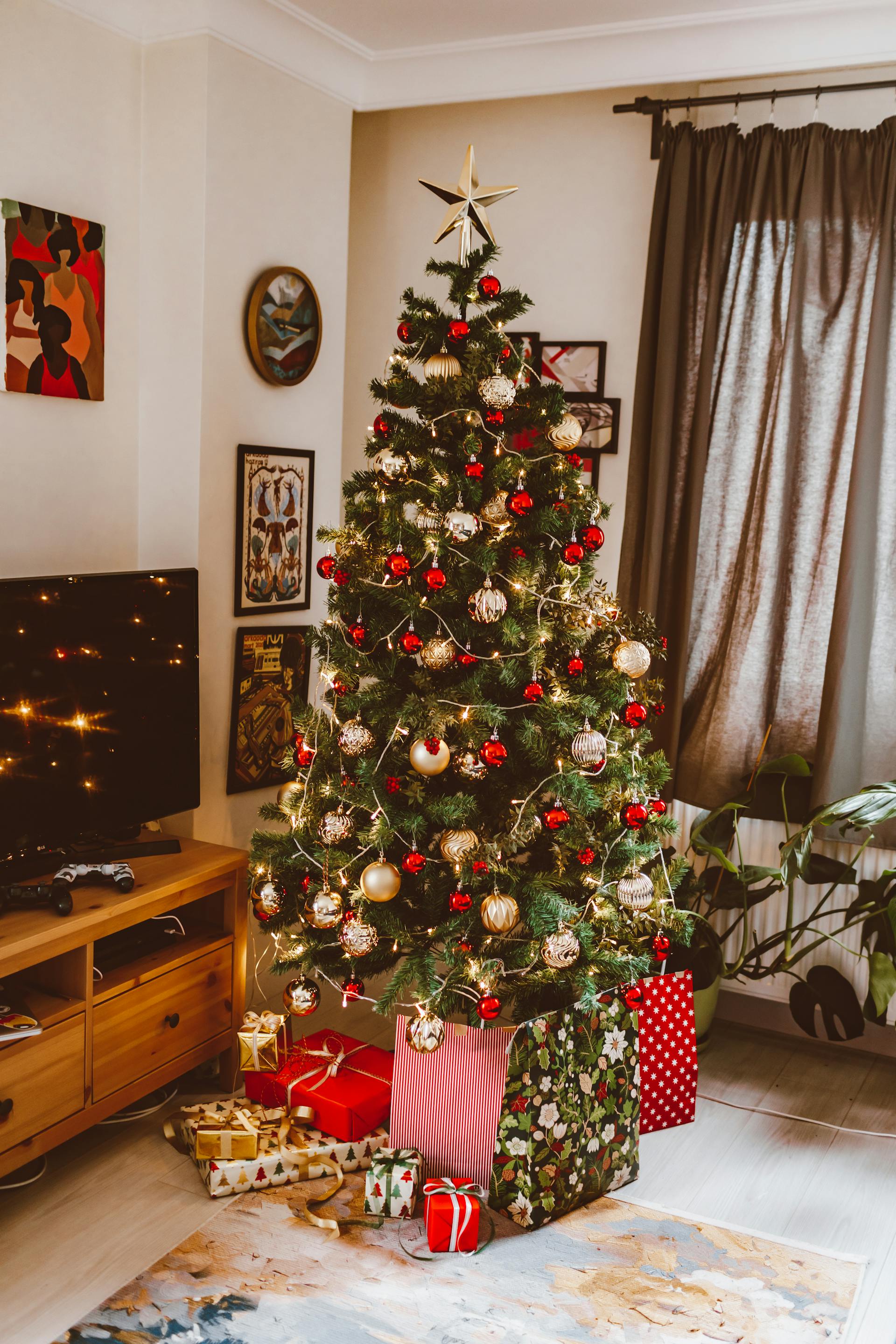 Gift boxes lying under a Christmas tree | Source: Pexels