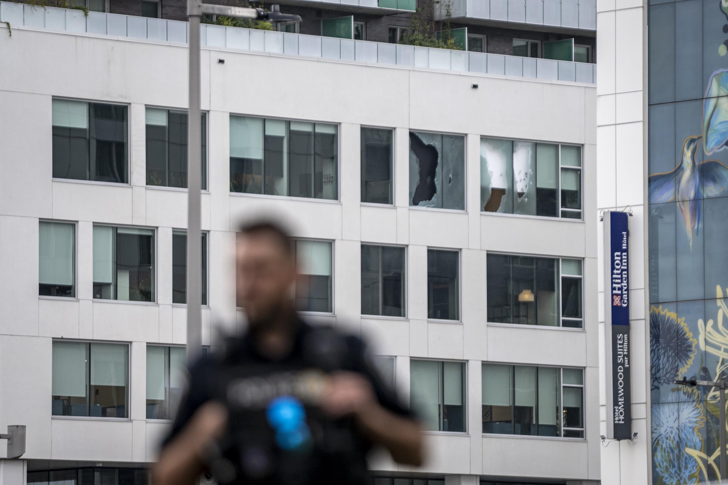 Damage visible on a nearby building offered a reminder of how intense the exchange of gunfire was during the shooting. CBC News reported that video verified by the broadcaster captured at least 29 shots in less than a minute as police confronted the suspect. | Source: Getty Images