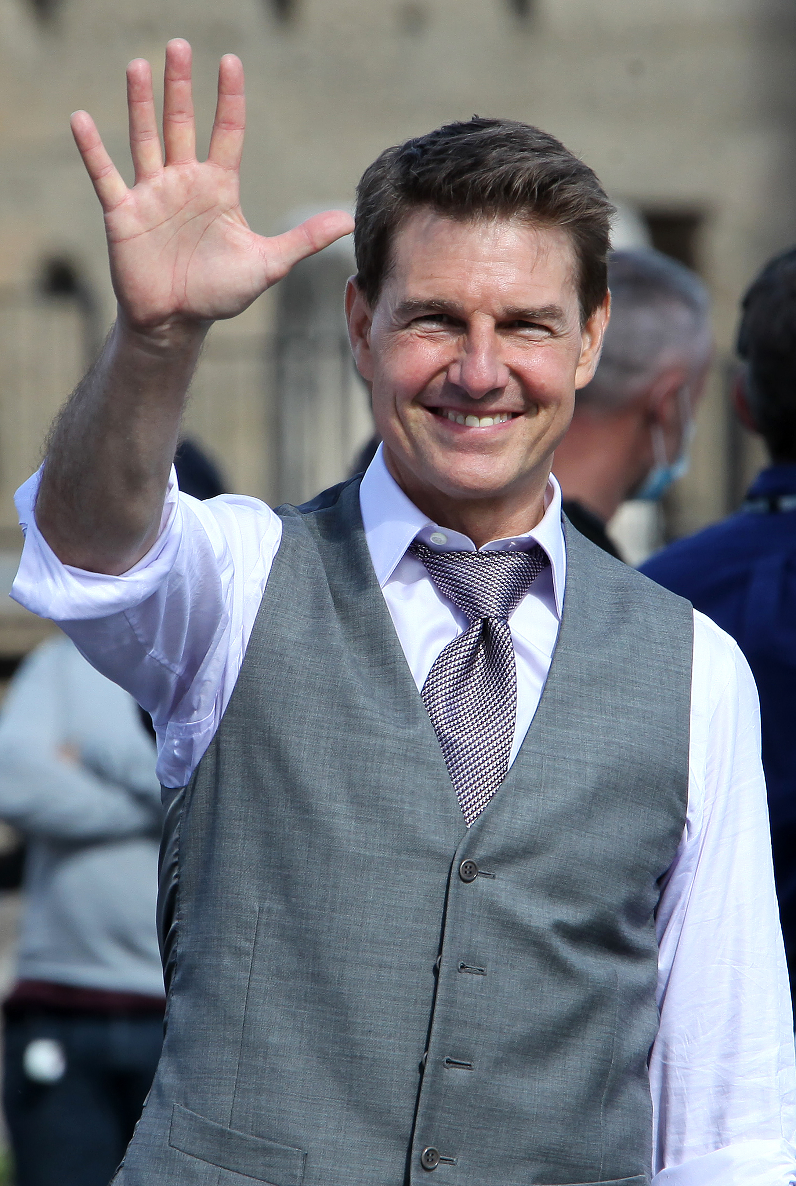 Tom Cruise waving to fans during a break in the shooting of a film on October 12, 2020. | Source: Getty Images