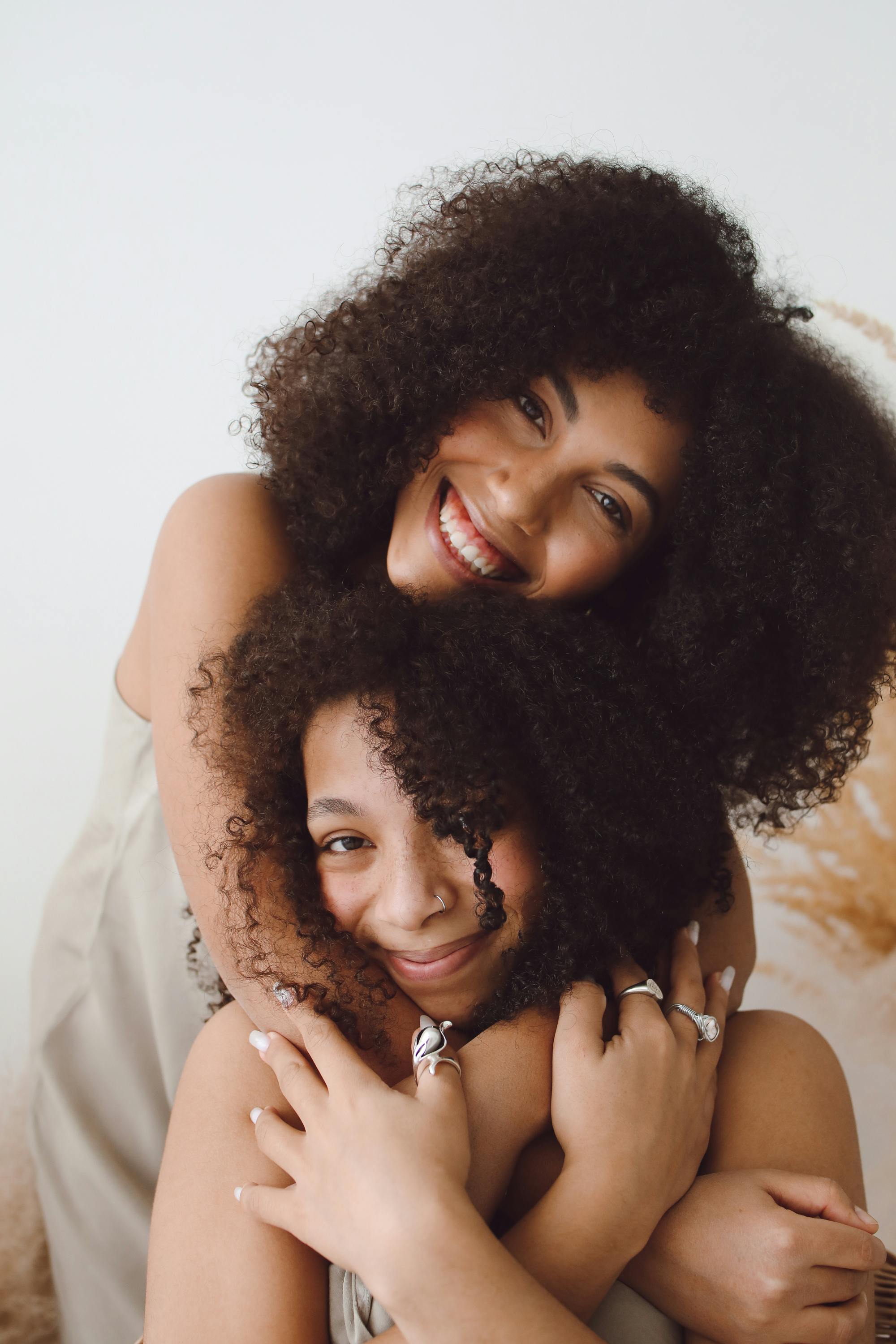 Two happy women embracing | Source: Pexels