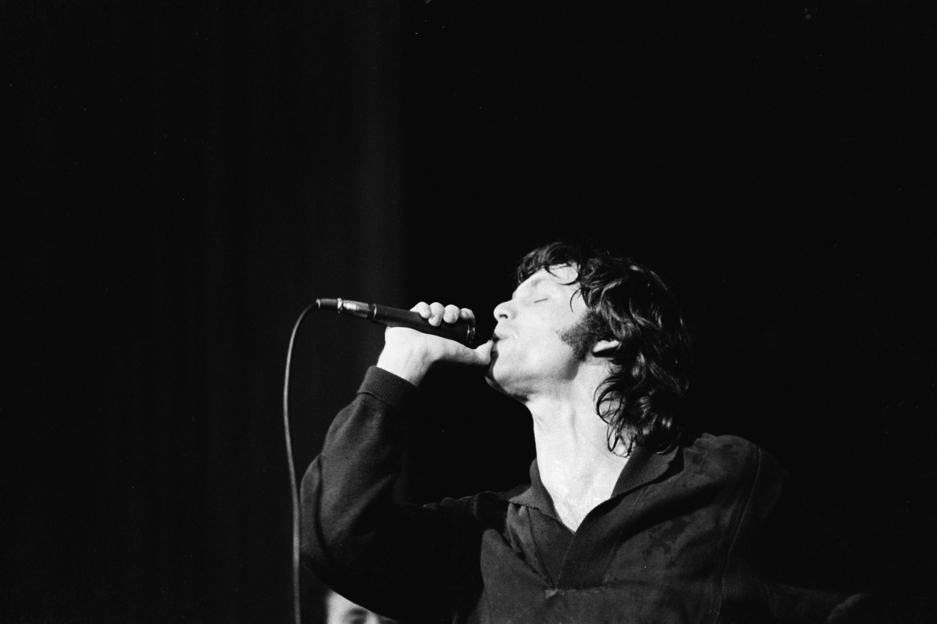 American Rock singer Jim Morrison (1943 - 1971), of the group the Doors, performs onstage at Town Hall, Philadelphia, Pennsylvania, June 18, 1967. | Source: Getty Images