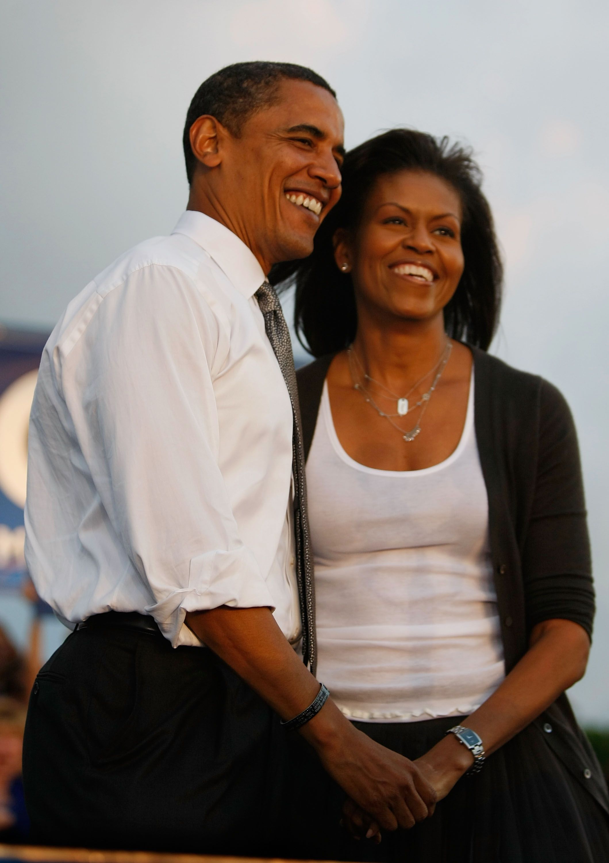 Democratic presidential nominee Barack Obama stands with his wife Michelle Obama during a campaign rally October 21, 2008 in Miami, Florida | Source: Getty Images 