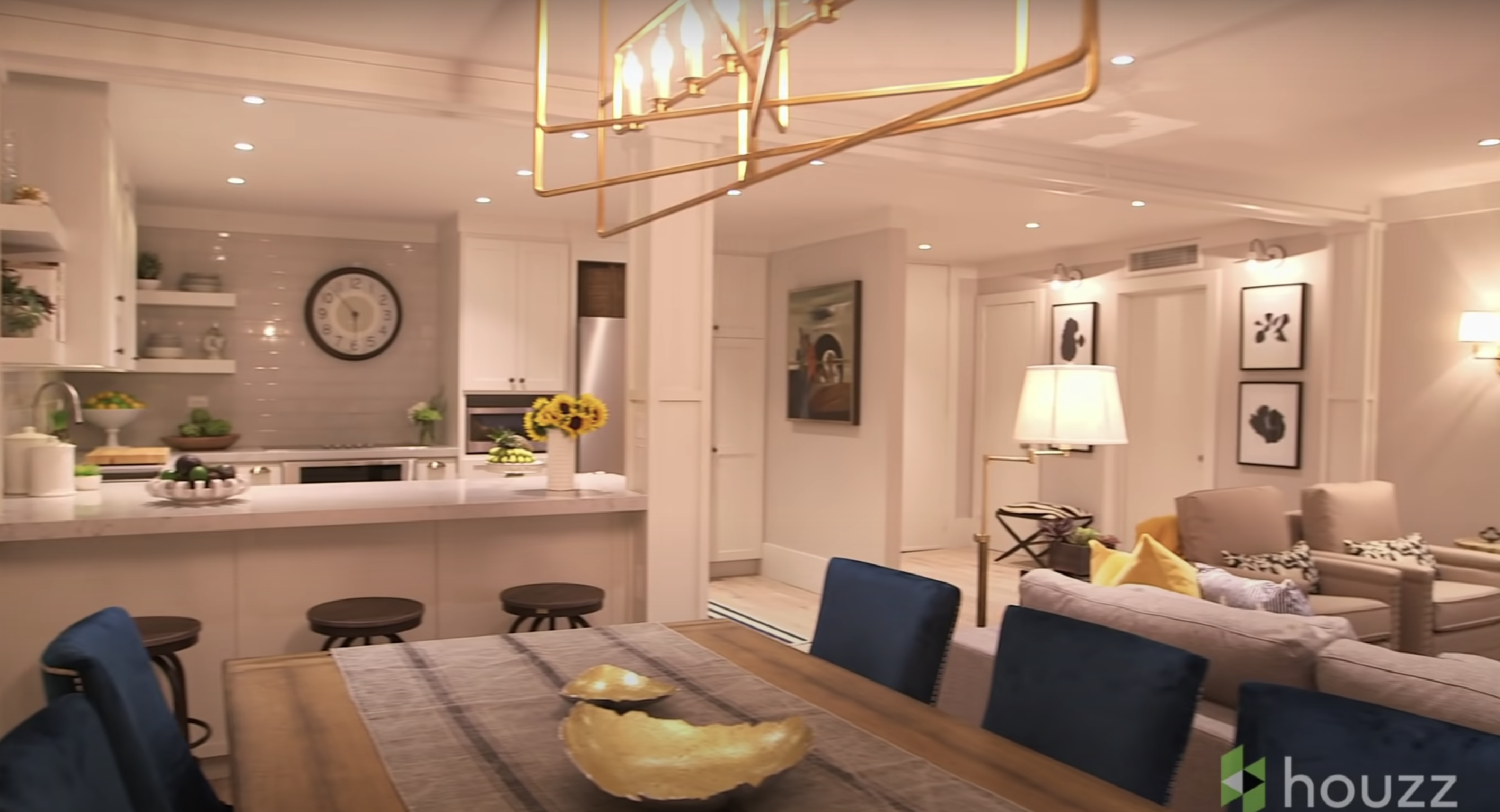 The spruced-up kitchen area and living space of Mila Kunis' family condo | Source: Youtube.com/HouzzTV