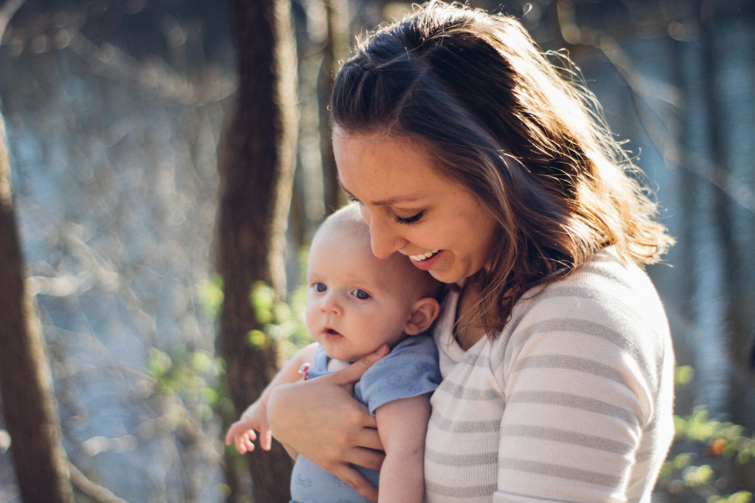 A woman holding a baby | Source: Unsplash