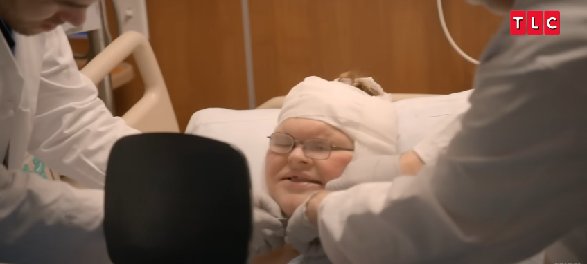 Bandages come off while Tammy stares into the mirror, silent and tense, from a video posted on June 11, 2025 | Source: YouTube/AccessHollywood