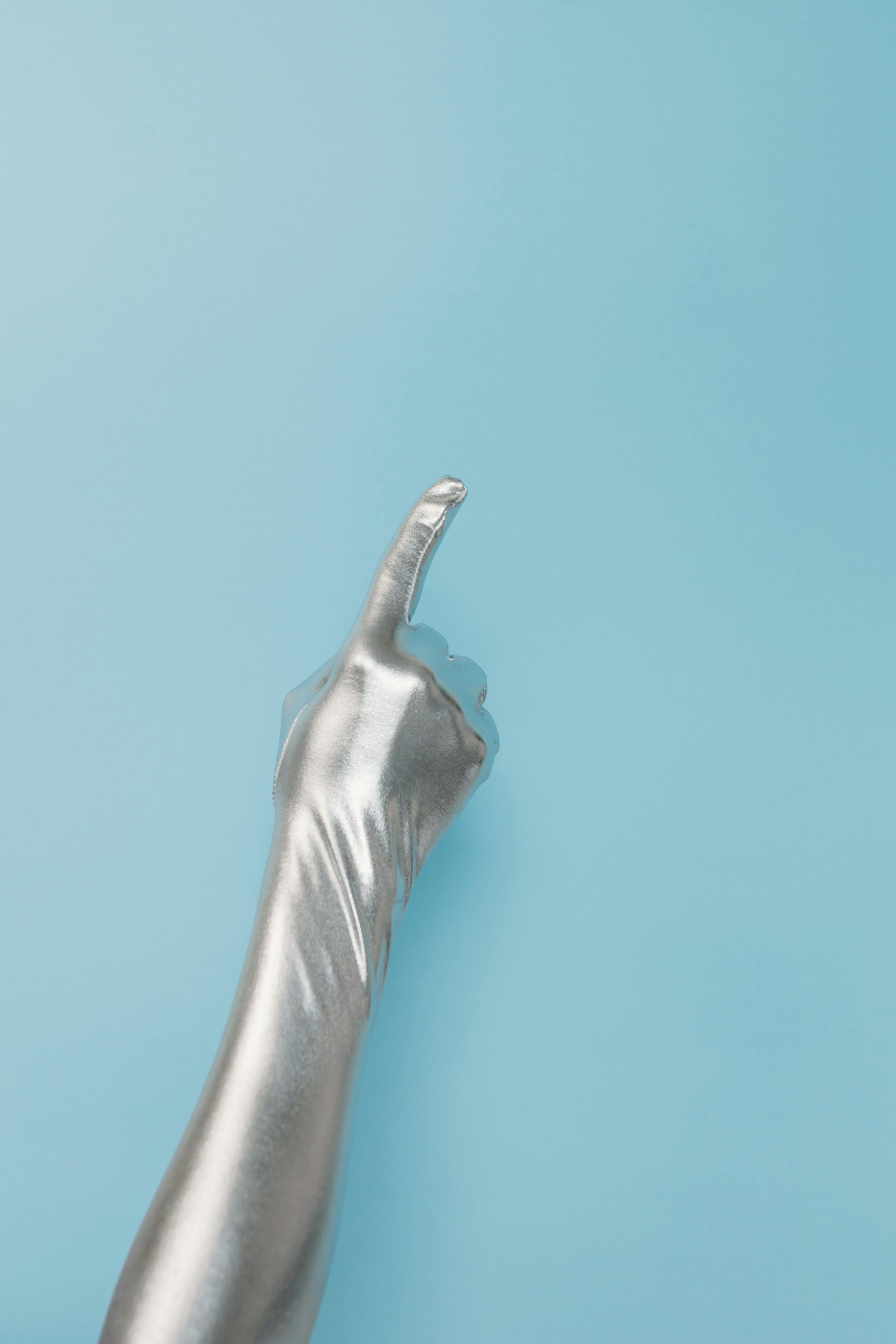 A pointing gloved hand | Source: Pexels