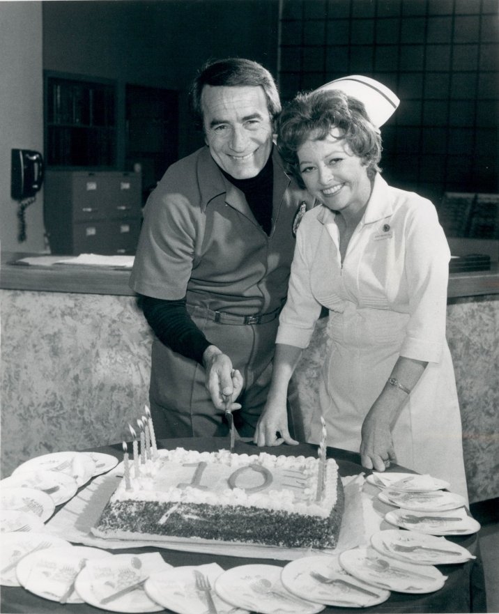 A publicity photo for the 10th Anniversary of "General Hospital." featuring John Beradino (as Dr. Steve Hardy) and Emily McLaughlin (as Jessie Brewer) on March 1, 1973 | Photo: Wikipedia/ABC Television