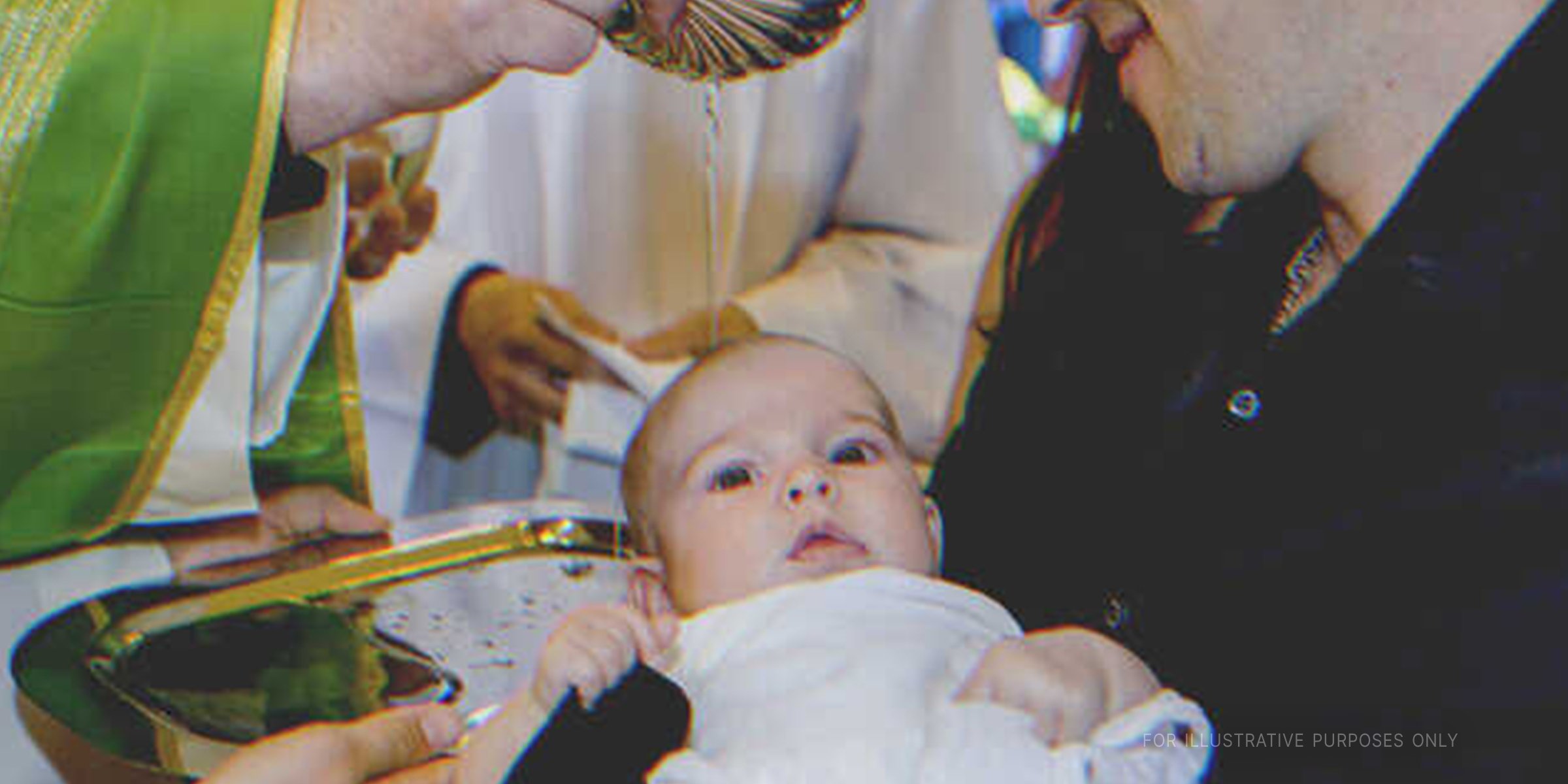 A baby being baptized. | Getty Images