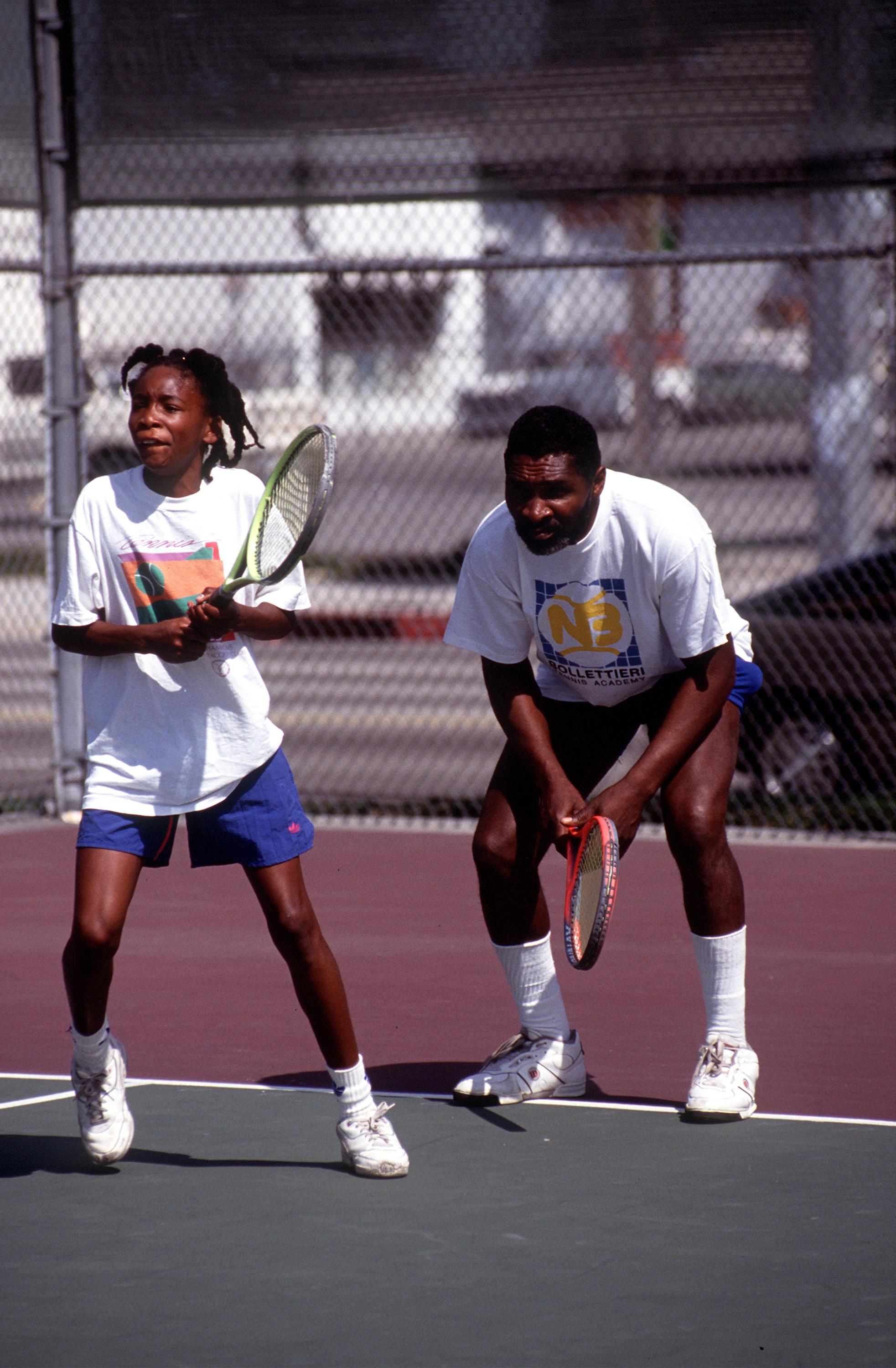  Richard WIlliams is pictured with his daughter, Venus, during a training session at the Compton tennis courts on April 20, 1991, in South Central Los Angeles, California | Source: Getty Images