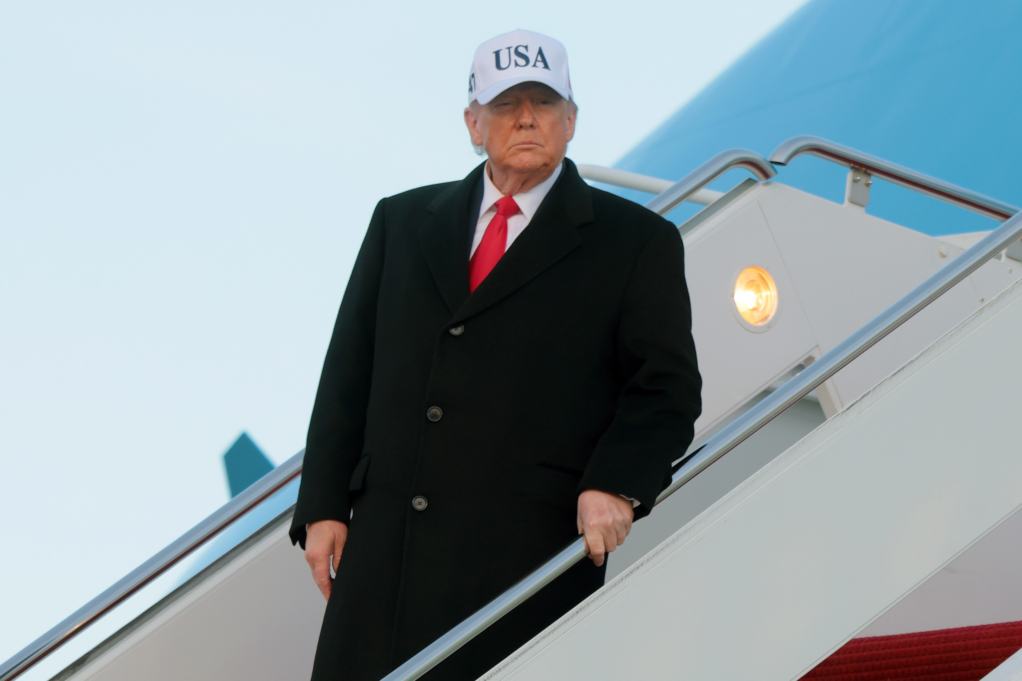 Donald Trump walks down the air stairs after landing on Air Force One on January 13, 2026 at Joint Base Andrews, Maryland | Source: Getty Images