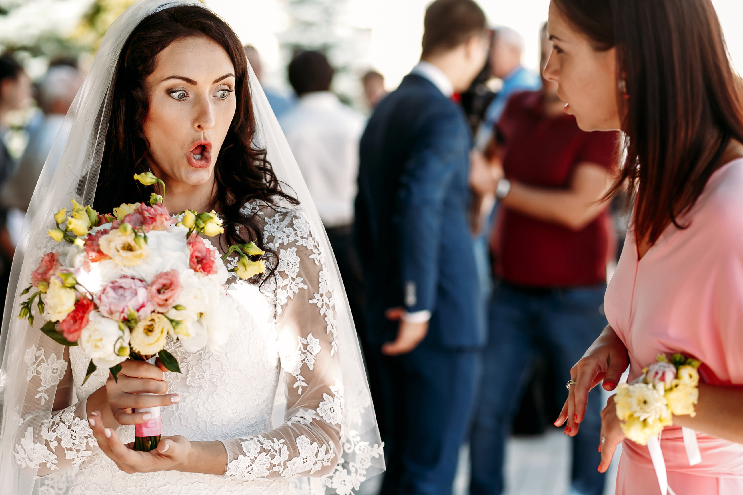 A bride talks to someone another woman at her wedding | Source: Shutterstock