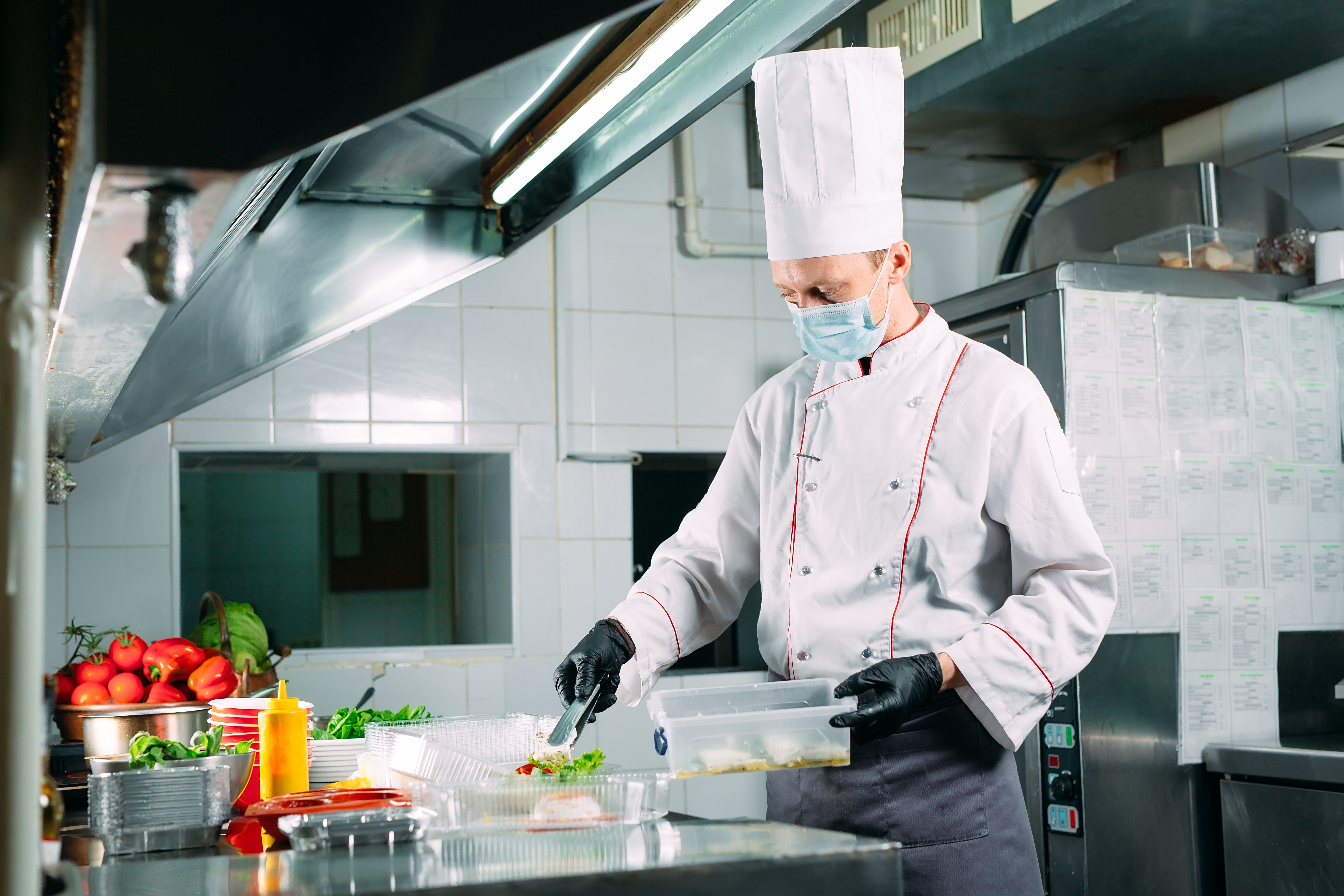 A chef working in a restaurant kitchen | Source: Shutterstock