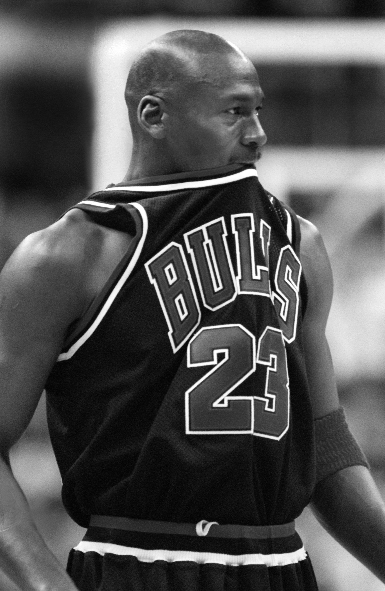 Michael Jordan bites on his jersey during a break in the action in 1st half at MCI Center on February 28, 1998 | Source: Getty Images