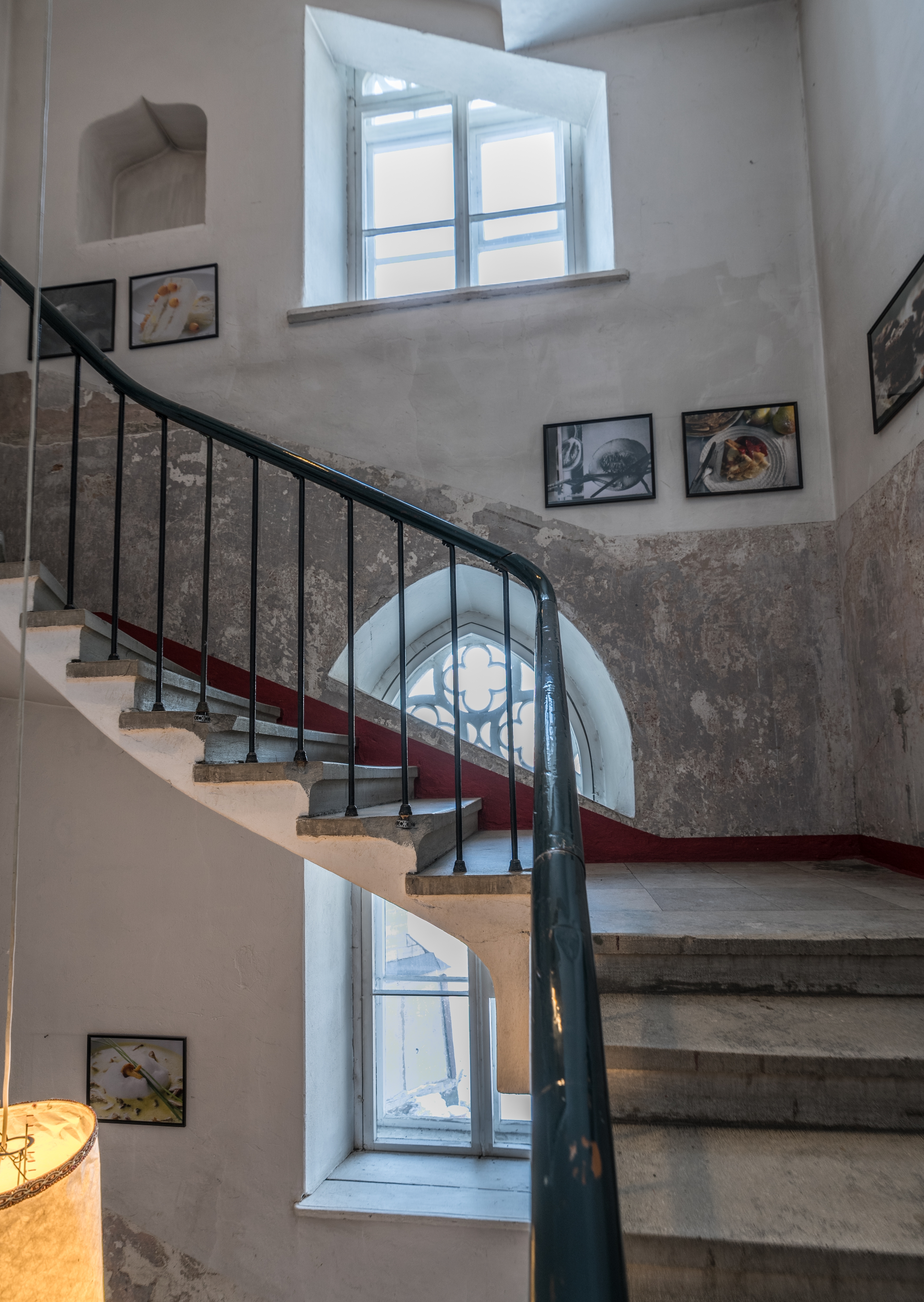Photos hung along the walls of a staircase | Source: Shutterstock