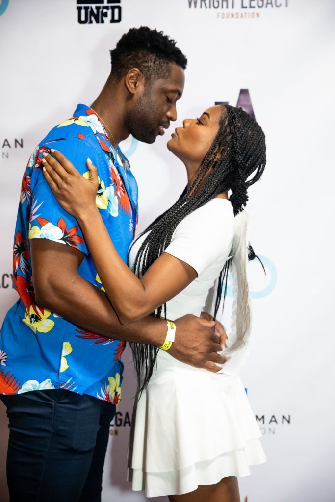 Dwyane Wade (L) and Gabrielle Union (R) pose together at the Wright Legacy Foundation skate night at World | Photo: Getty Images