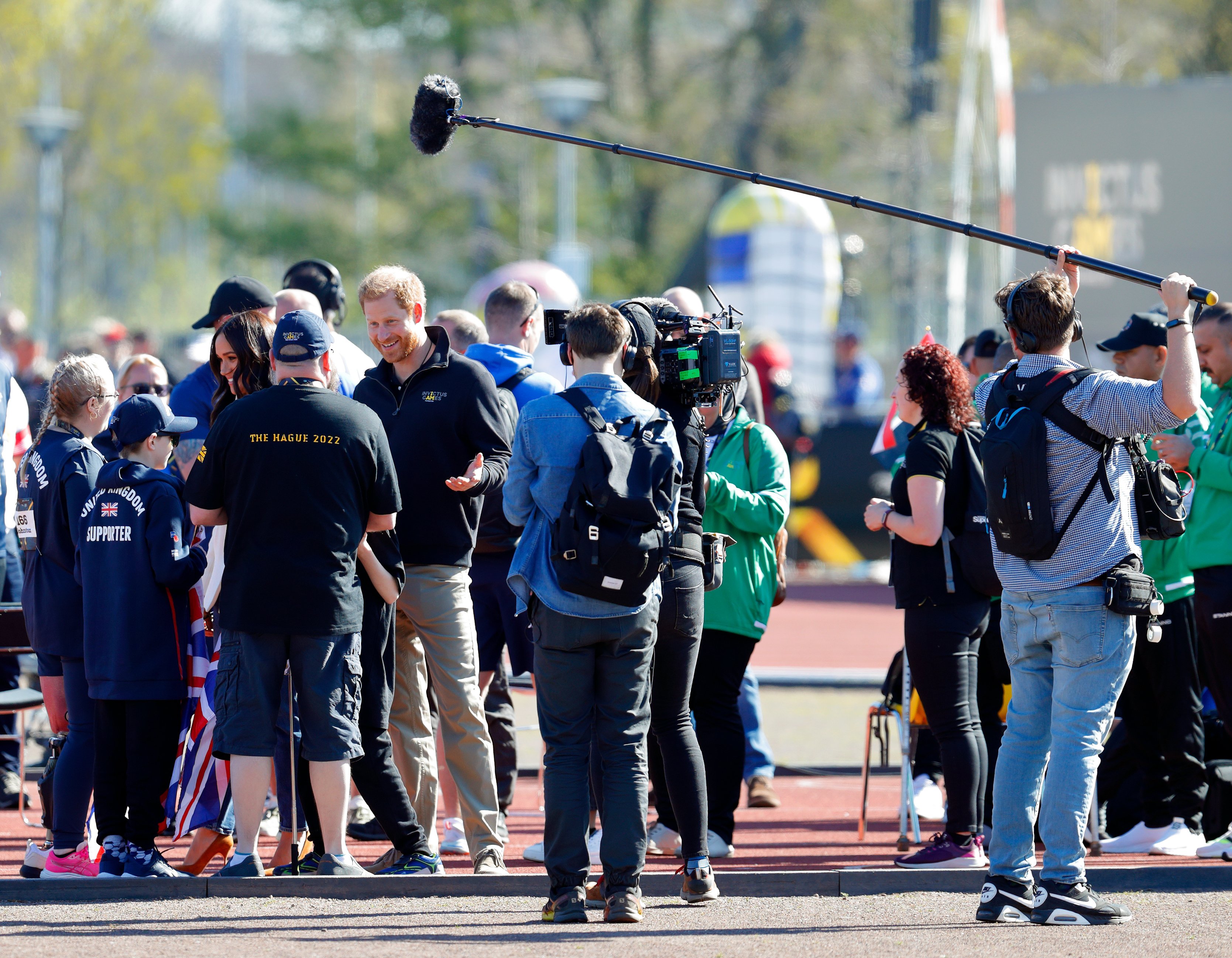 Meghan, Duchess of Sussex and Prince Harry, Duke of Sussex (accompanied by a film crew) meet athletes and their supporters at the athletics competition on day 2 of the Invictus Games 2020 at Zuiderpark on April 17, 2022 in The Hague, Netherlands. | Source: Getty Images