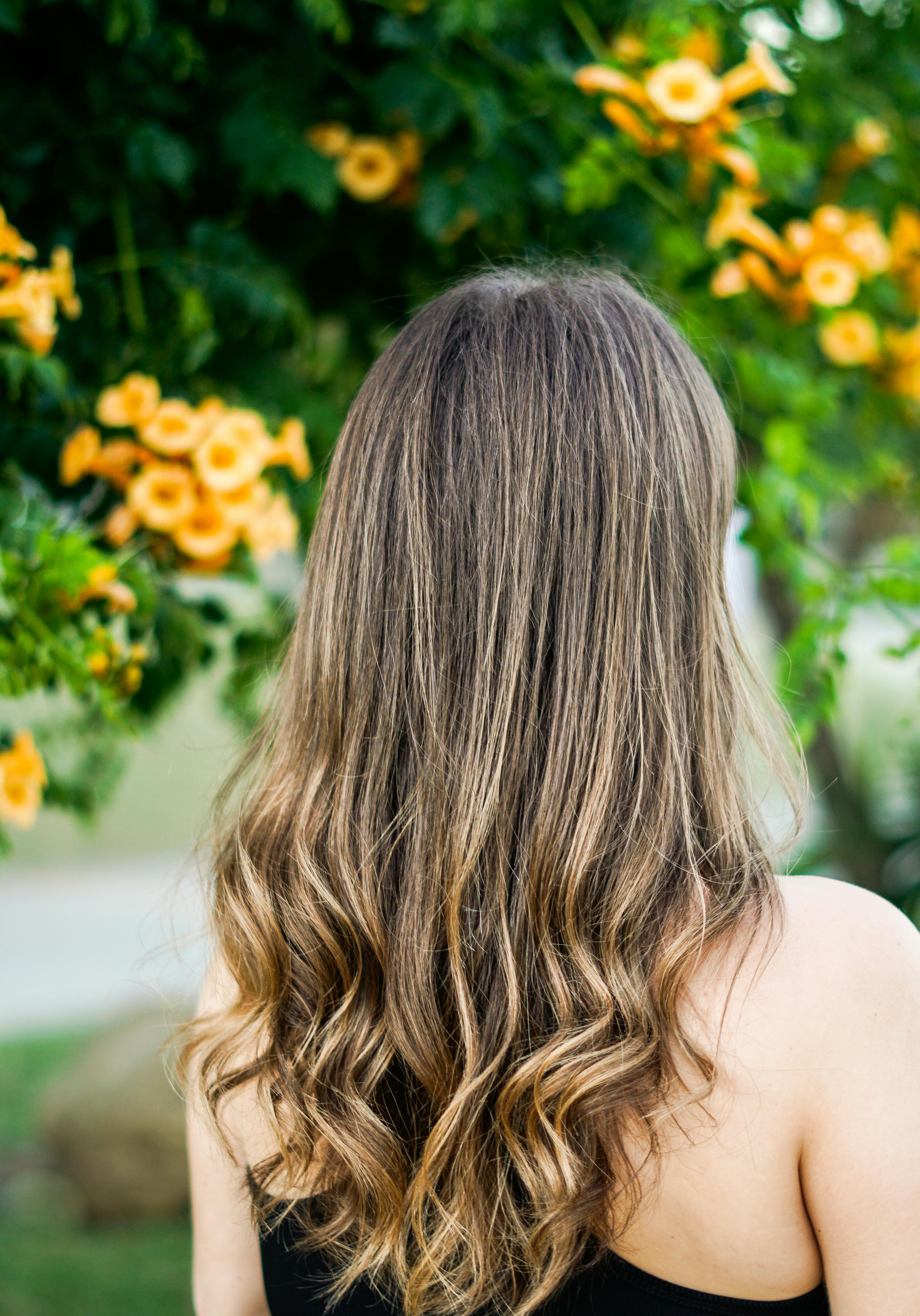 A woman in her garden | Source: Pexels