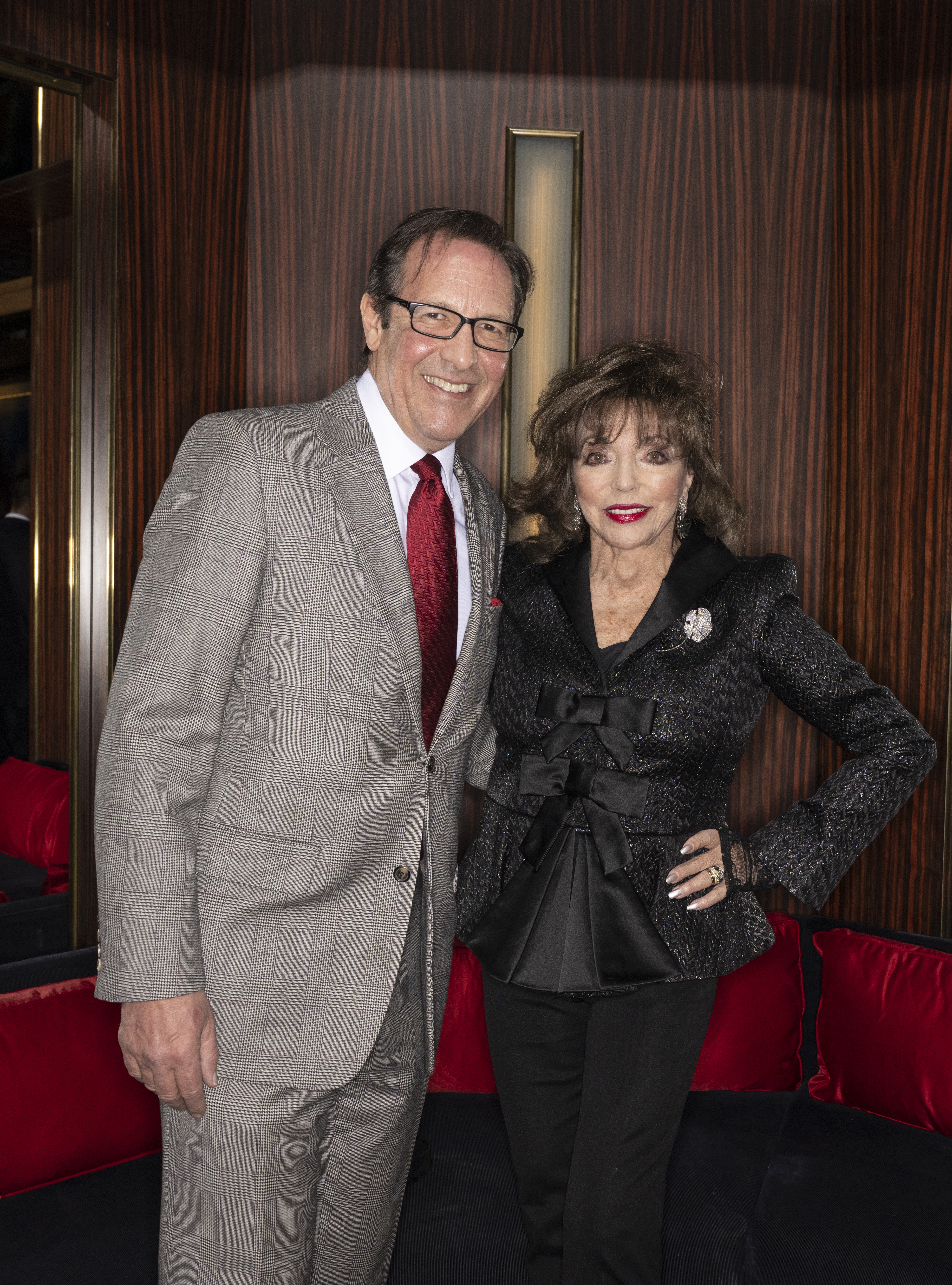Percy Gibson and Joan Collins at the dinner for A Rabbit's Foot presents "Power of Film" on February 28, 2023 in London, England | Source: Getty Images