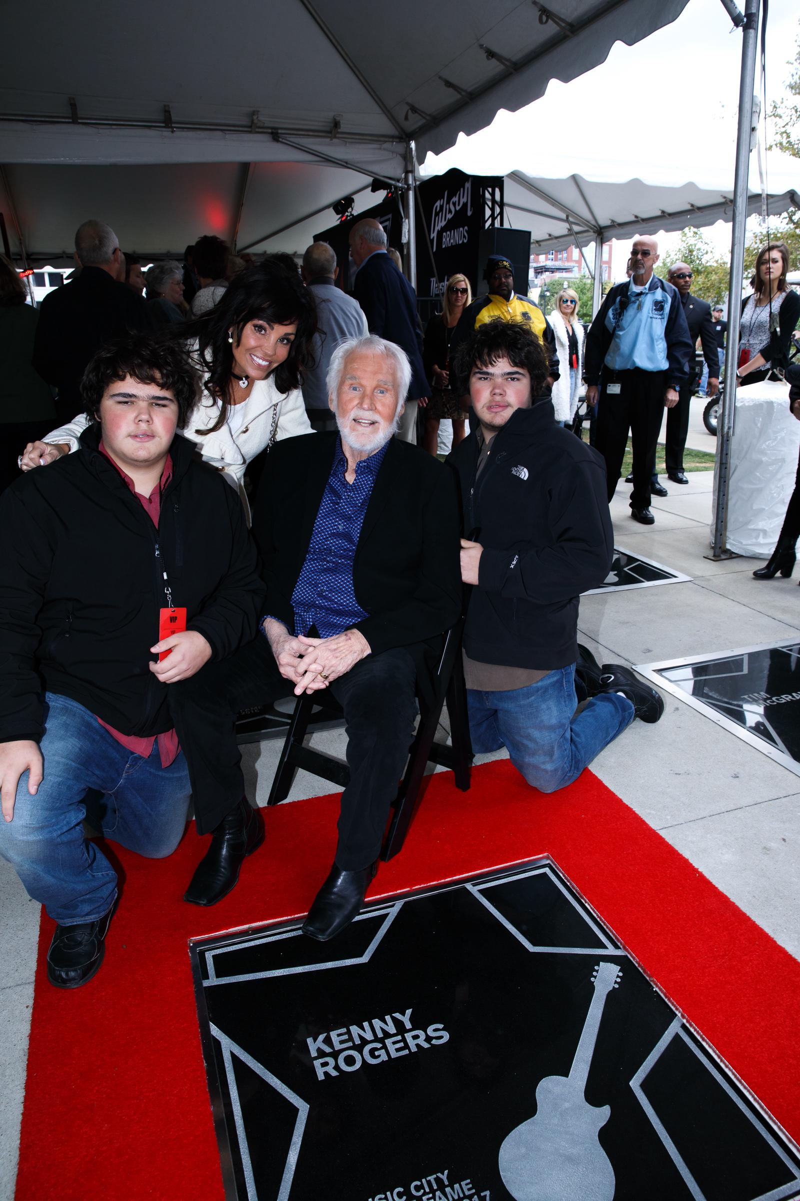 Kenny Rogers is joined by his wife Wanda and their twin sons Justin and Jordan during his Nashville Music City Walk of Fame induction | Source: Getty Images