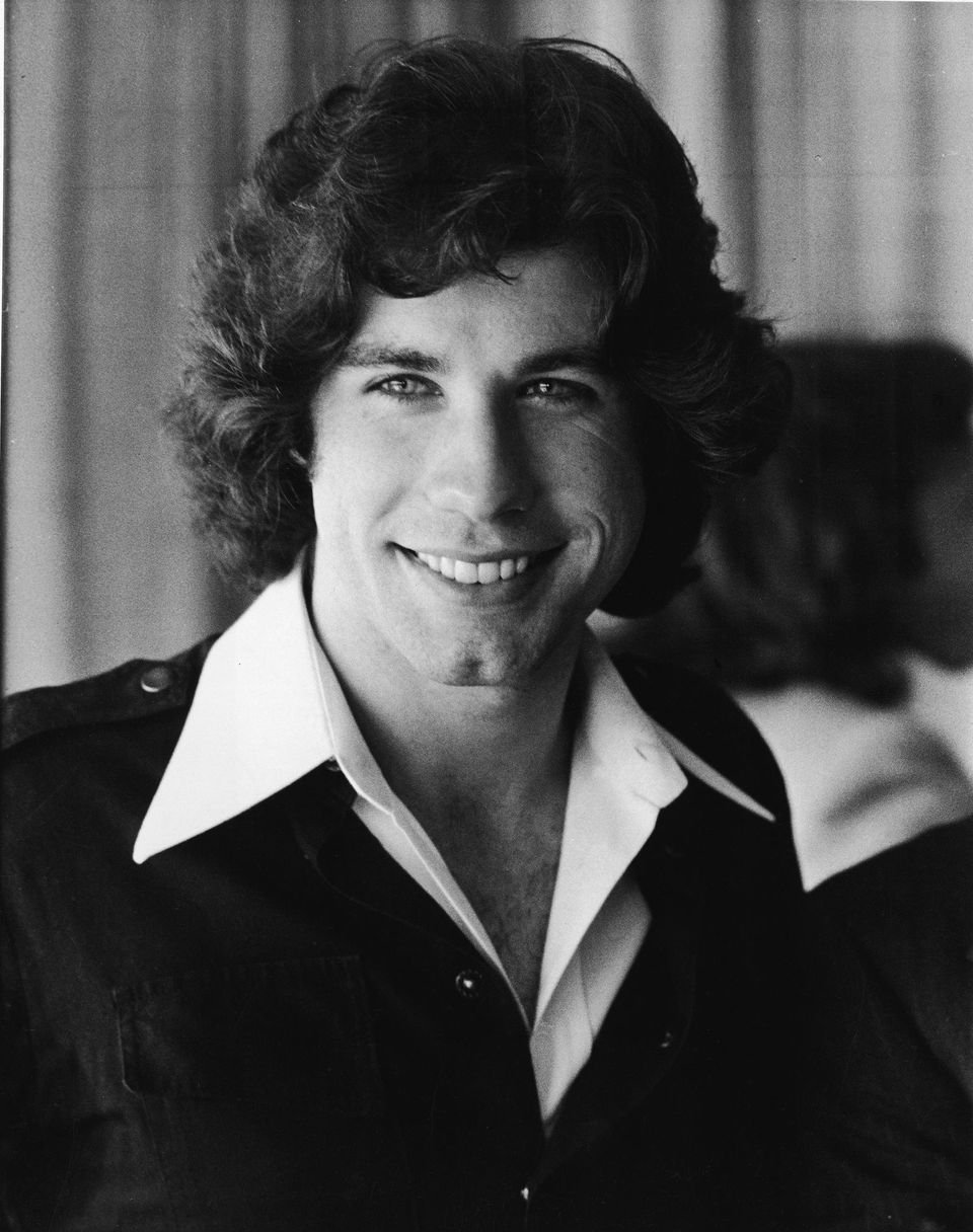 John Travolta smiles in a photograph for "Welcome Back Knotter," late 1970s. | Source: Getty Images
