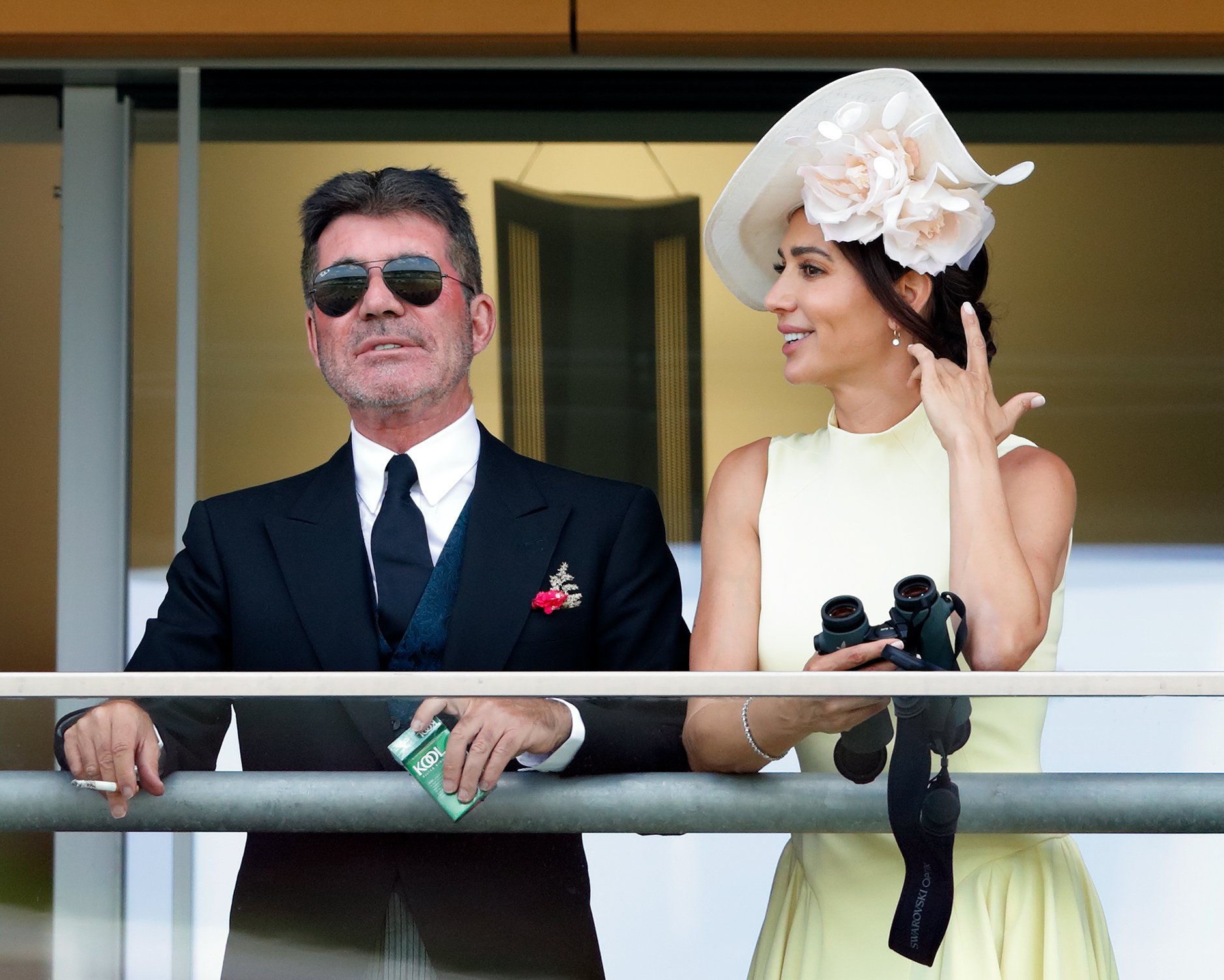 Simon Cowell and Lauren Silverman watch the racing at the Royal Ascot Racecourse on June 15, 2021, in Ascot, England | Source: Getty Images