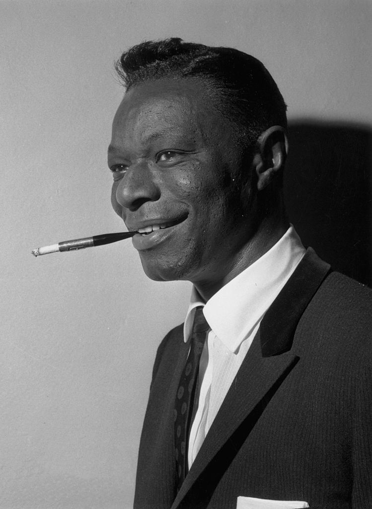  American singer and pianist Nat 'King' Cole during a visit to London. | Photo: Getty Images