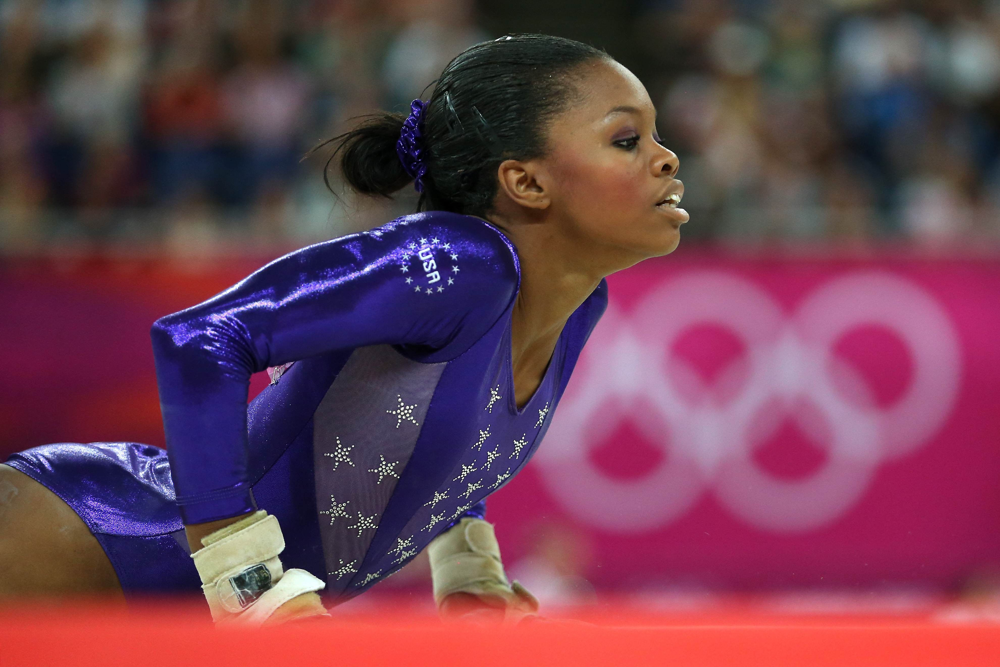 Gabrielle Douglas of the United States competes in the floor exercise in the Artistic Gymnastics Women's Team qualification on Day 2 of the London 2012 Olympic Games at North Greenwich Arena on July 29, 2012 in London, England. | Source: Getty Images