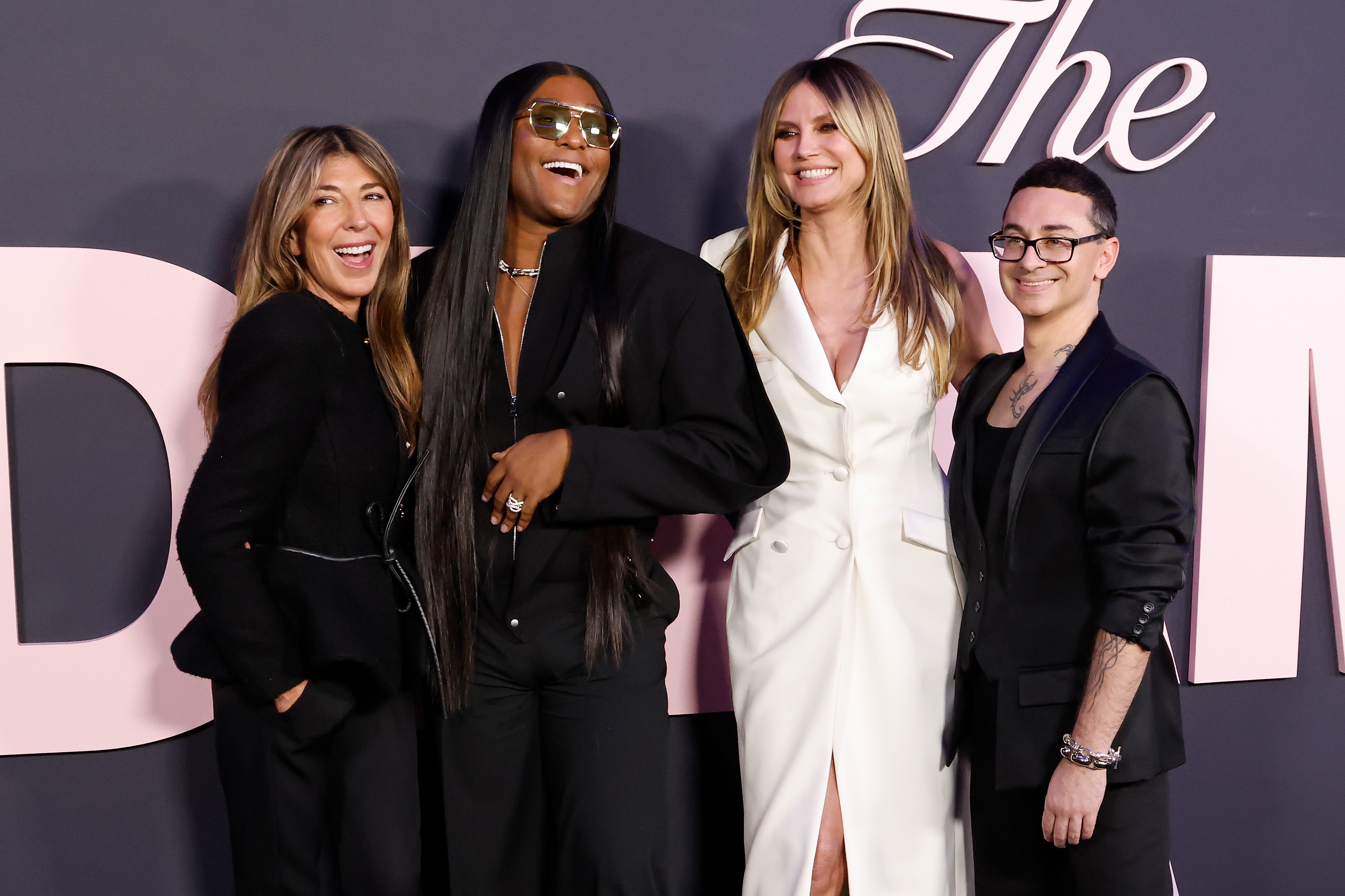 Nina García, Law Roach, Heidi Klum, and Christian Siriano share a lighthearted moment together as the "Project Runway" team prepares for another season of high-stakes fashion competition. | Source: Getty Images