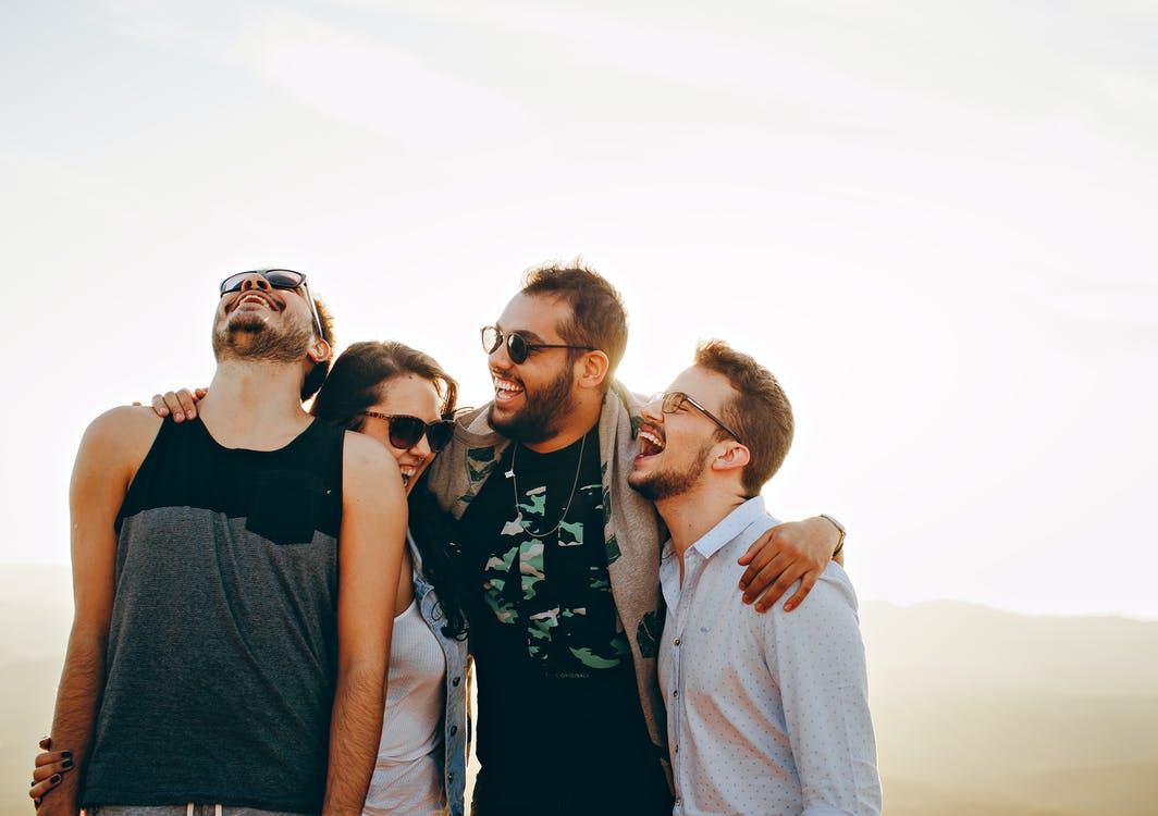 A group consisting of three guys and a lady. | Photo: Pexels