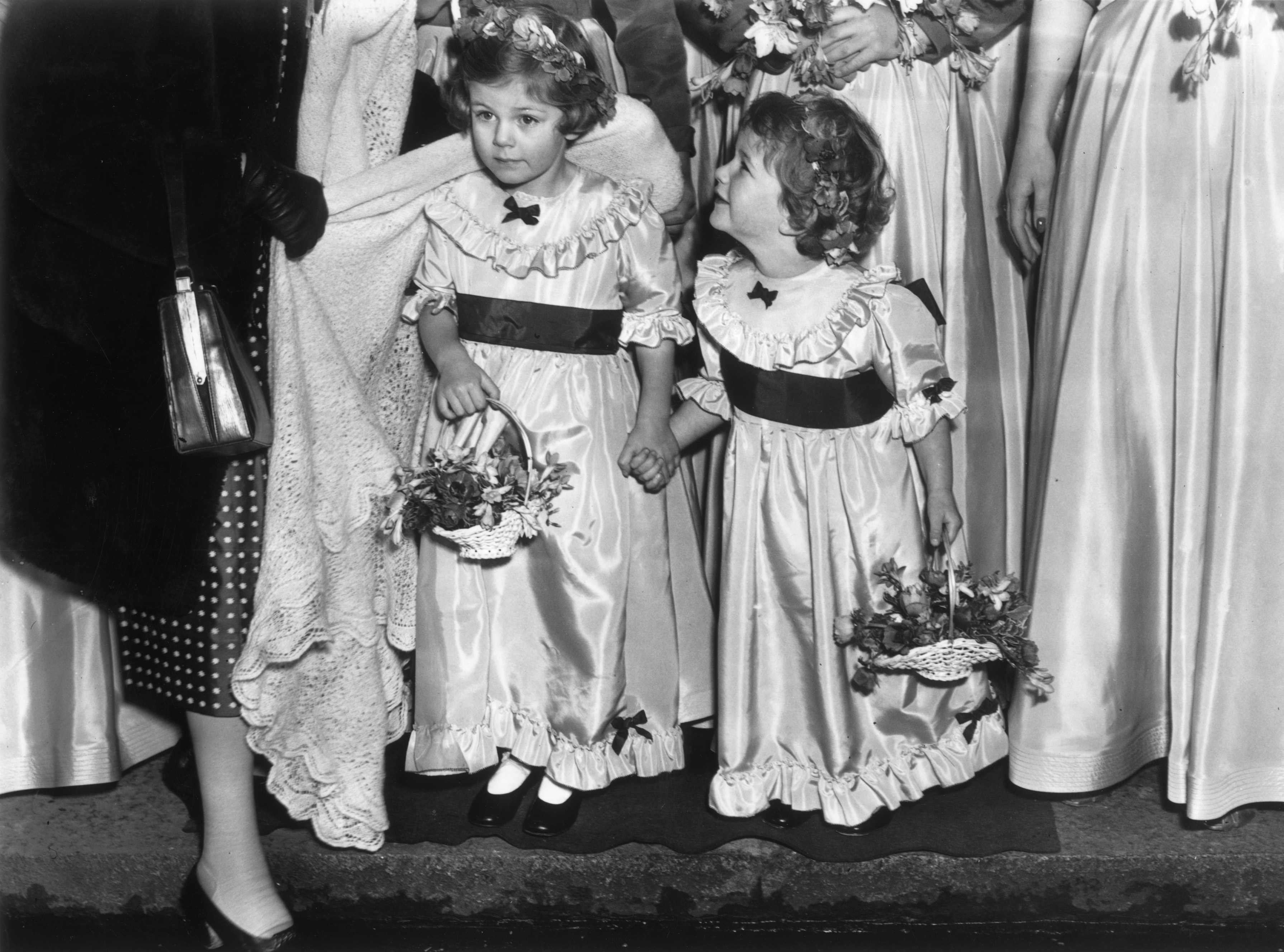 Queen Camilla and her sister at a wedding in London, England, on January 17, 1952. | Source: Getty Images