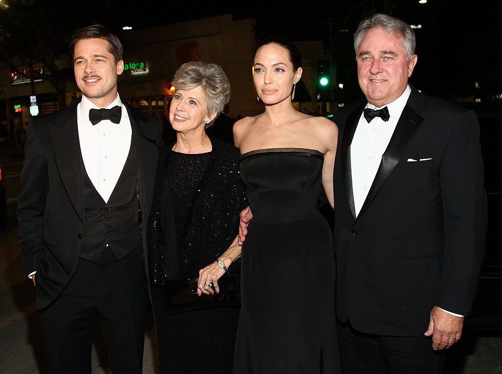 Brad Pitt with his parents and Angelina Jolie at the premiere of Paramount's "The Curious Case Of Benjamin Button" held at Mann's Village Theatre on Decemeber 8, 2008 in Westwood, California. | Photo: Getty Images
