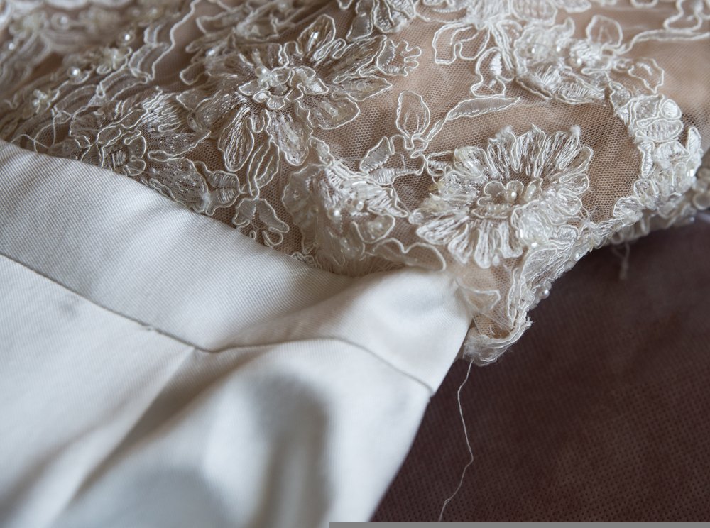 A close up photo of a ripped wedding dress. | Photo: Shutterstock