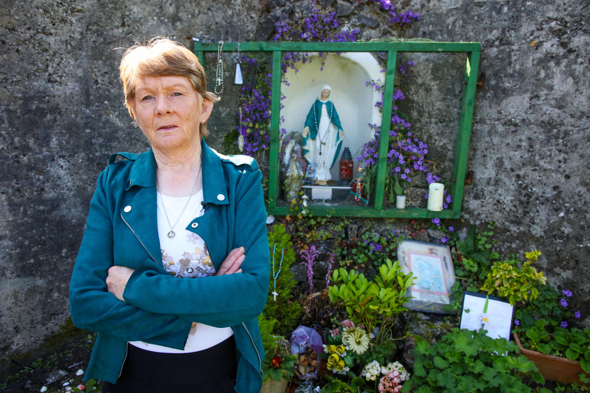 Historian Catherine Corless poses on the site of the former St Mary's Mother and Baby Home, in Tuam, in the outskirts of Galway, western Ireland, on May 20, 2025 | Source: Getty Images