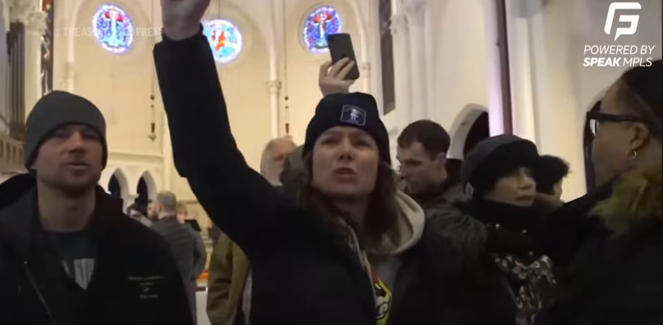Protestors seen chanting in a video posted on January 19, 2026 | Source: YouTube/Associated Press