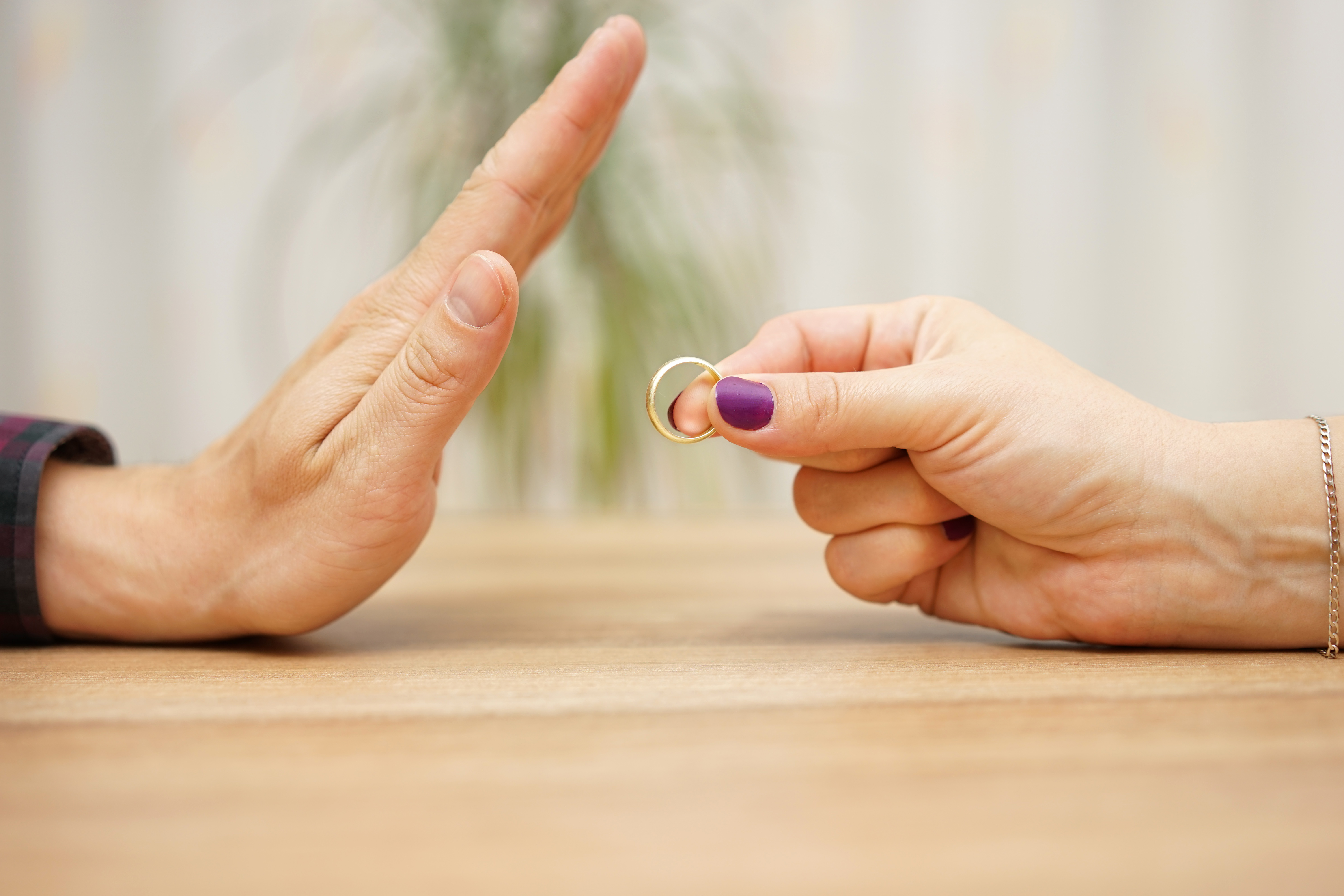 A man refusing a ring a woman is trying to give him | Source: Shutterstock