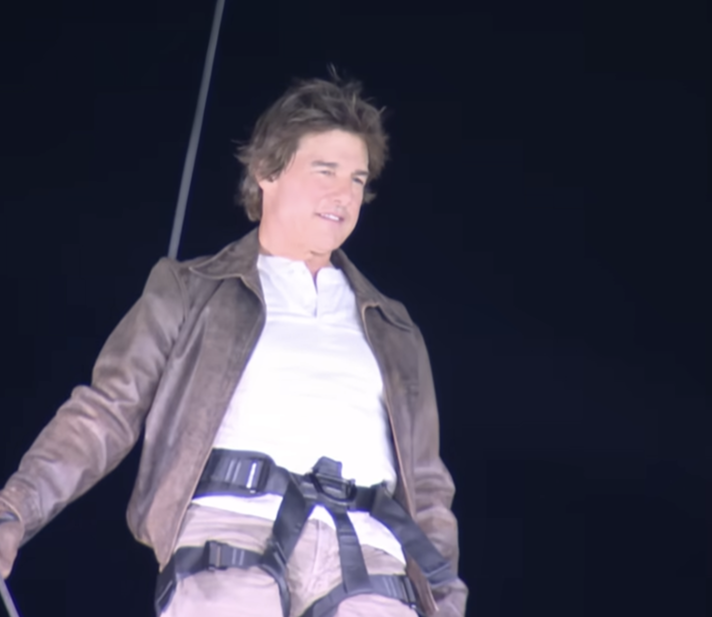 Tom Cruise skydiving during the closing ceremony of the Olympic Games on August 11, 2024 in Paris, France. | Source: YouTube/Olympics