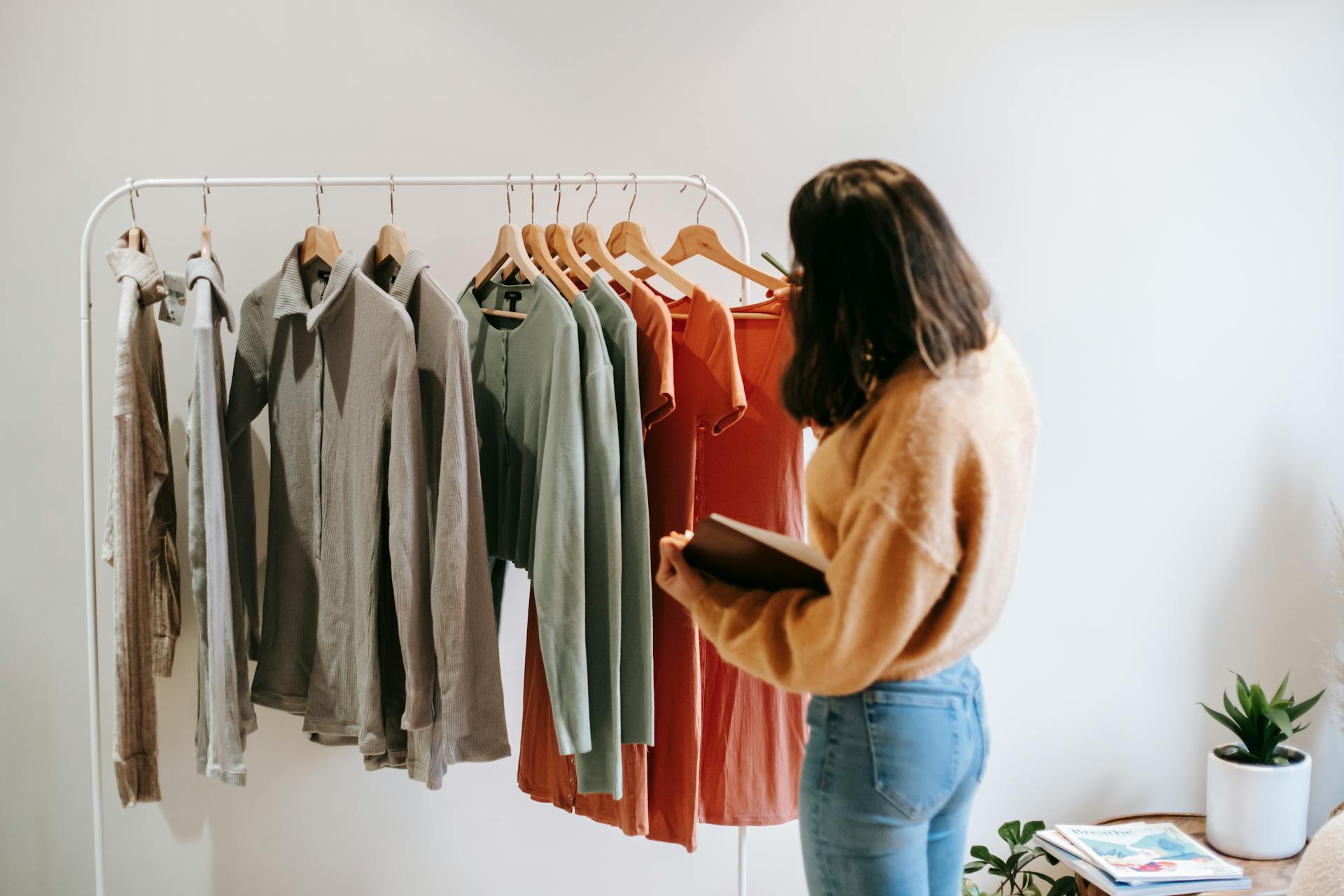 A girl looking at clothes | Source: Pexels