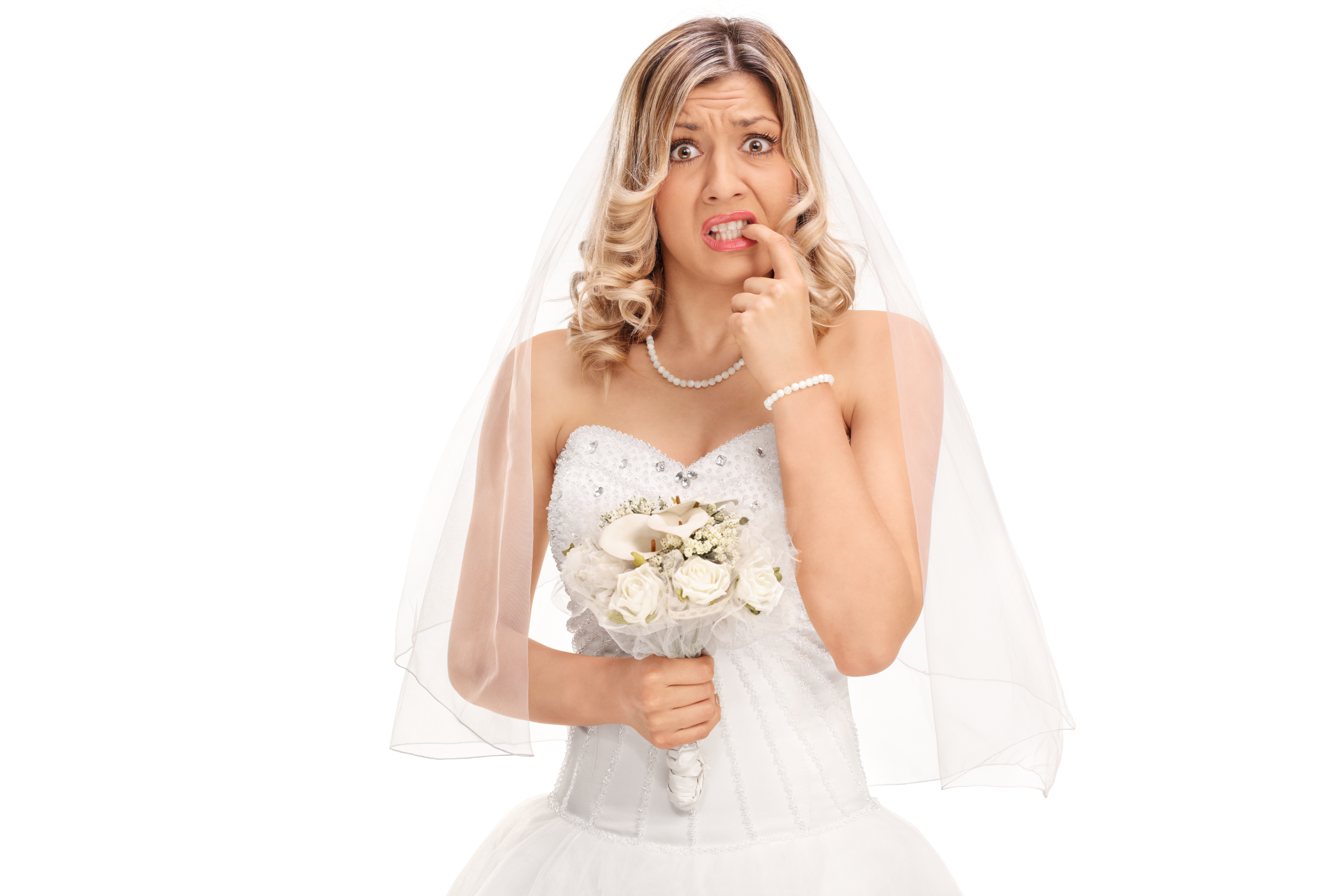 A nervous young bride biting her nails | Source: Shutterstock