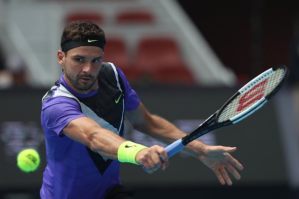Grigor Dimitrov of Bulgaria returns a shot in the Men's singles first round match against Andrey Rublev of Russia of 2019 China Open at the China National Tennis Center on September 30, 2019, in Beijing, China. | Source: Getty Images.