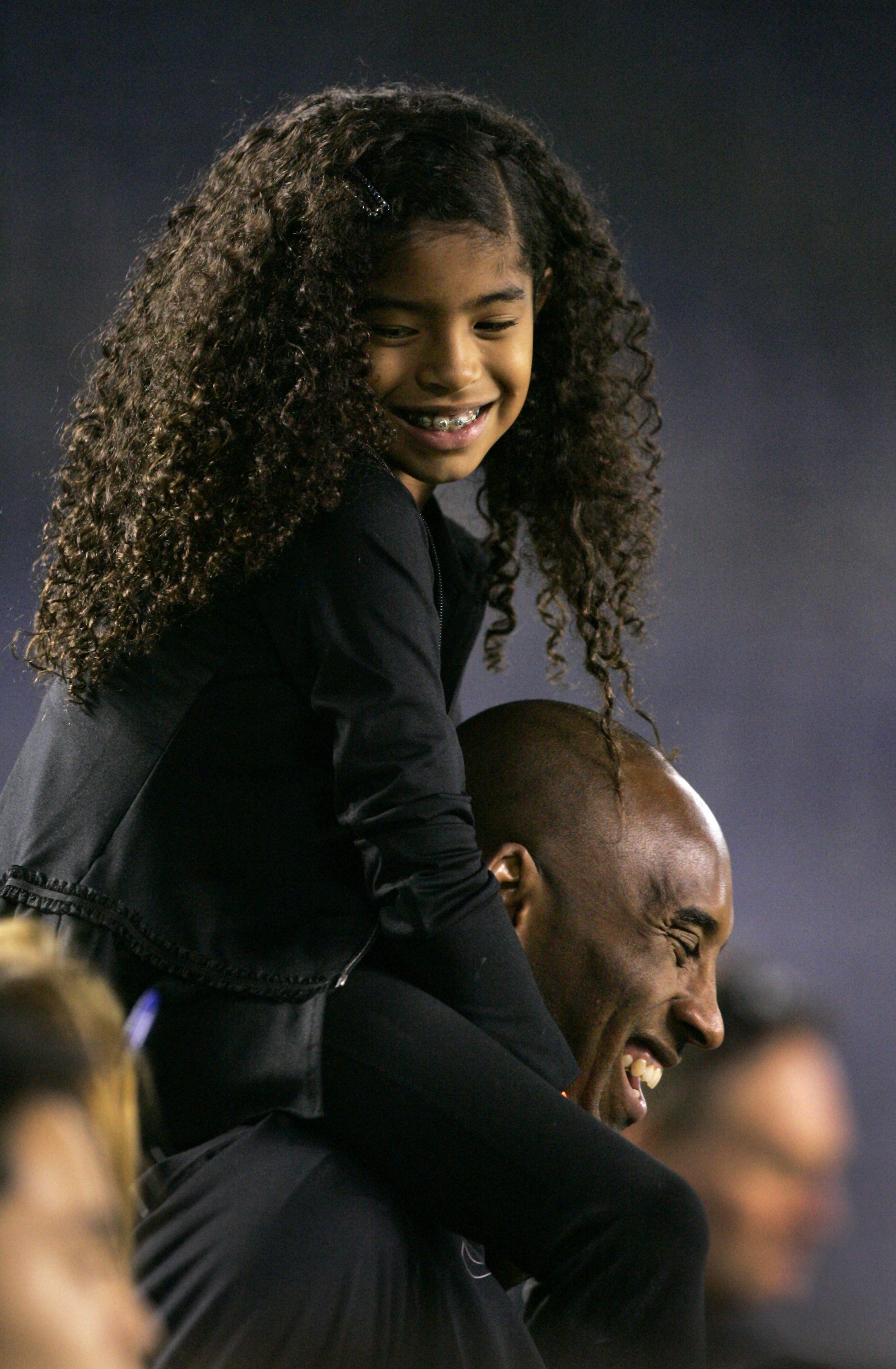 Kobe Bryant with his daughter Gianna Maria-Onore Bryant at the game against the United States and China during an international firendly match  on April 10, 2014, in San Diego, California. | Source: Getty Images.