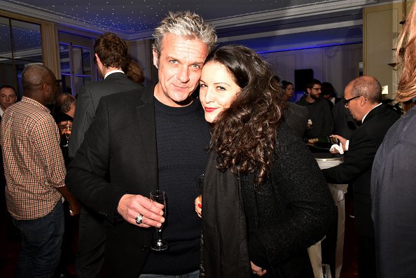 David Brecourt et Alexandra Sarramona à l'Automobile Club France le 16 décembre 2015 à Paris, France. | Photo : Getty Images