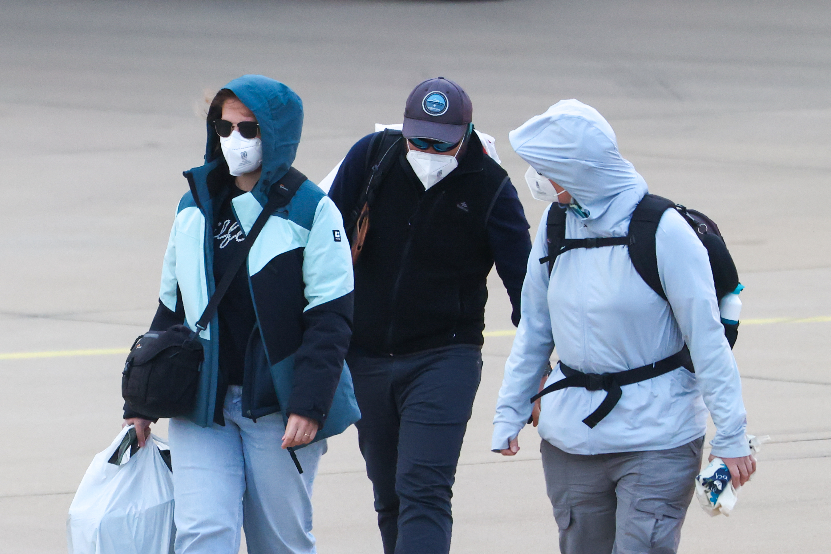 Passengers from the cruise ship affected by a hantavirus outbreak disembark from a plane at Eindhoven Airport | Source: Getty Images