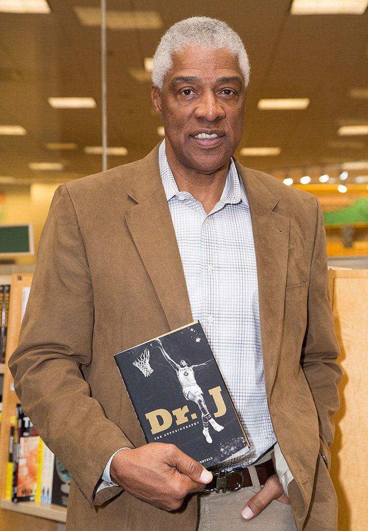 Julius Erving signs copies of his memoir "Dr. J: The Autobiography" at Barnes & Noble bookstore at The Grove on December 19, 2013 in Los Angeles, California. I Image: Getty Images.