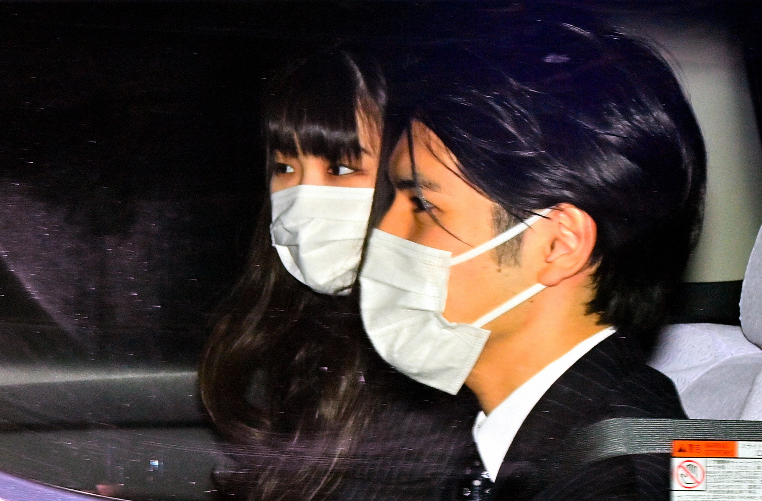 Princess Mako of Akishino, and Kei Komuro (R) are seen as they leave the hotel after a press conference on October 26, 2021 in Tokyo, Japan | Source: Getty Images