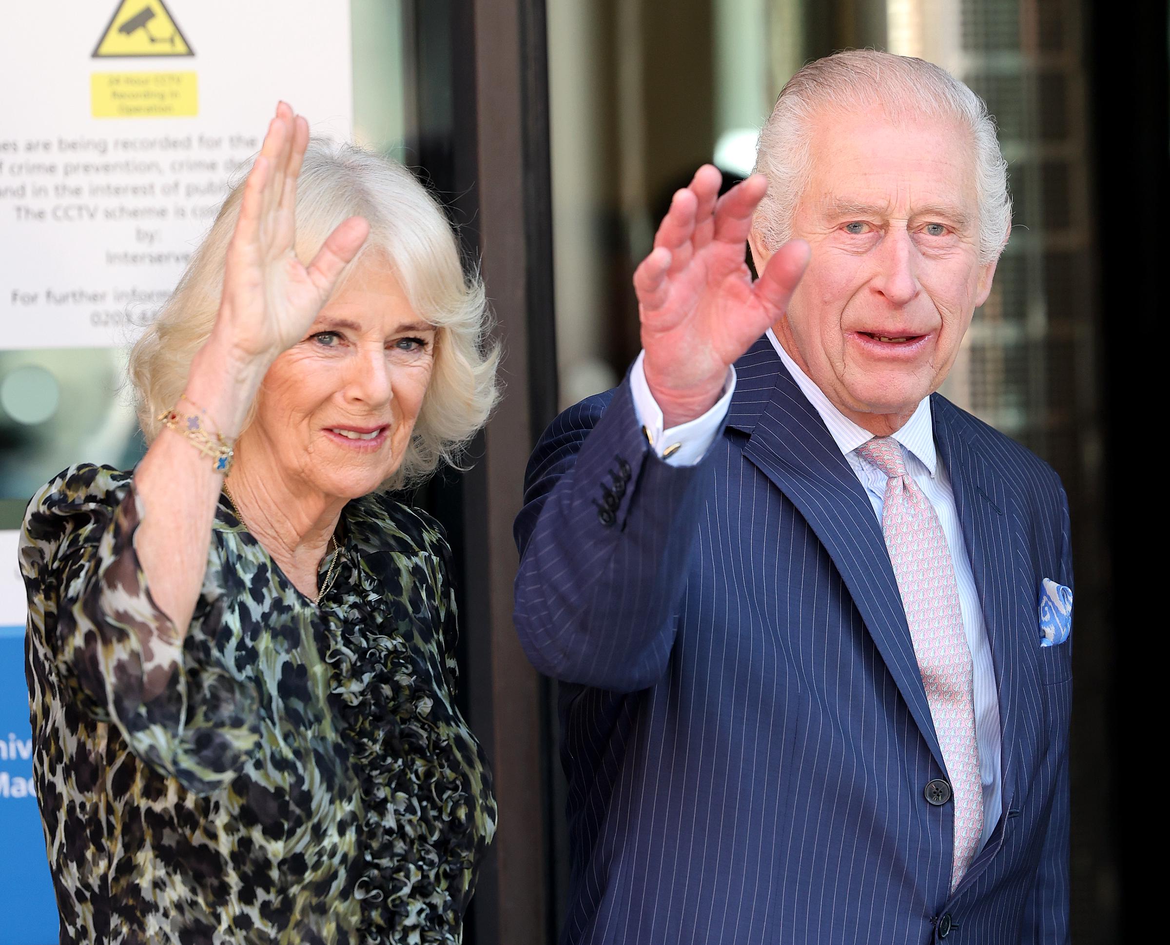 Queen Camilla and King Charles III wave as they depart the University College Hospital Macmillan Cancer Centre in London, England on April 30, 2024. | Source: Getty Images