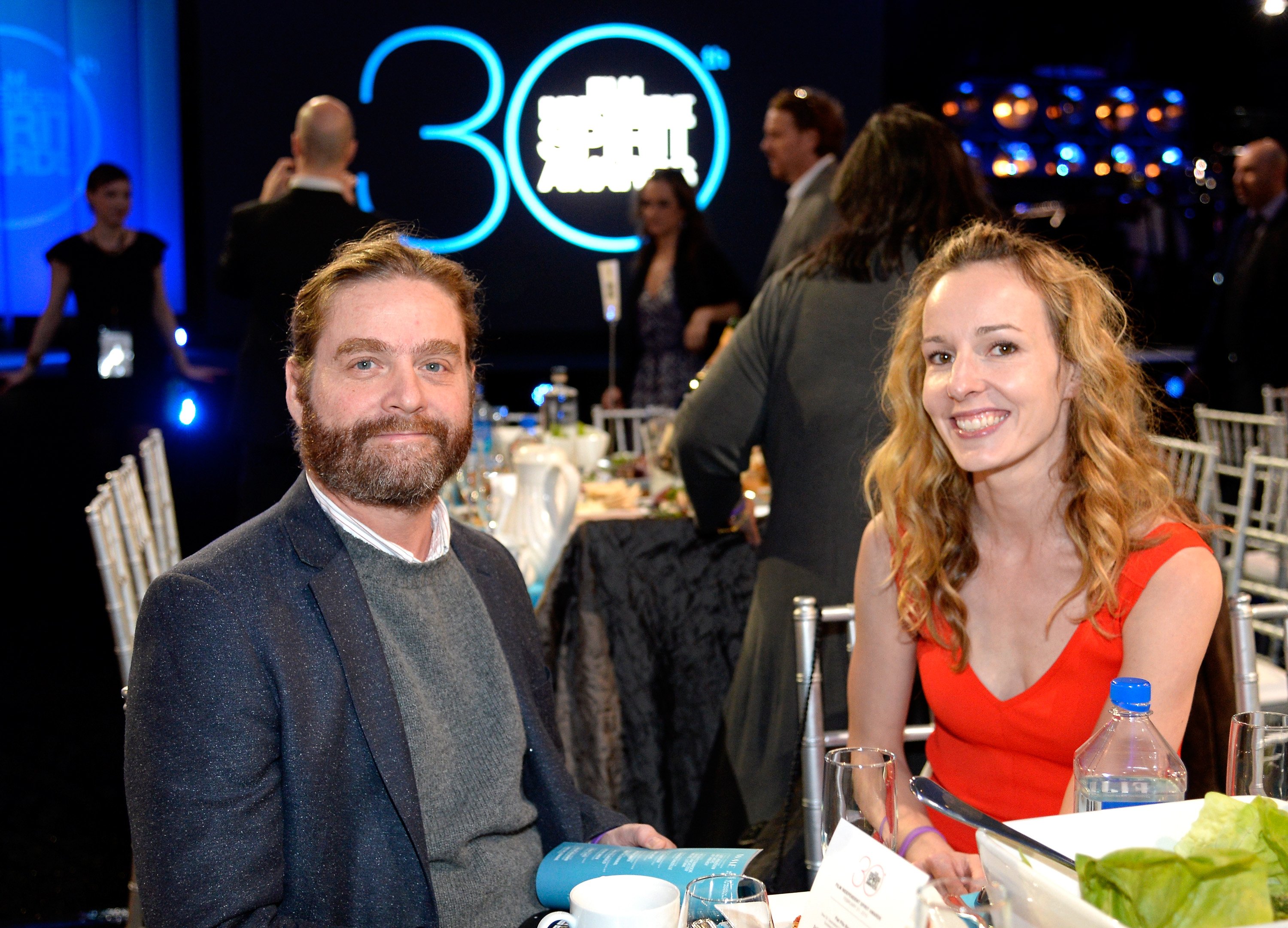 Zach Galifianakis (L) and Quinn Lundberg attend the 2015 Film Independent Spirit Awards at Santa Monica Beach on February 21, 2015 in Santa Monica, California. | Source: Getty Images