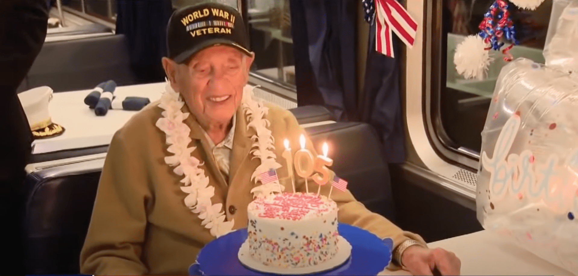 Joseph Eskanazi celebrating his 105th birthday with Gary Sinise and other veterans in 2023 | Source: youtube.com/fox11