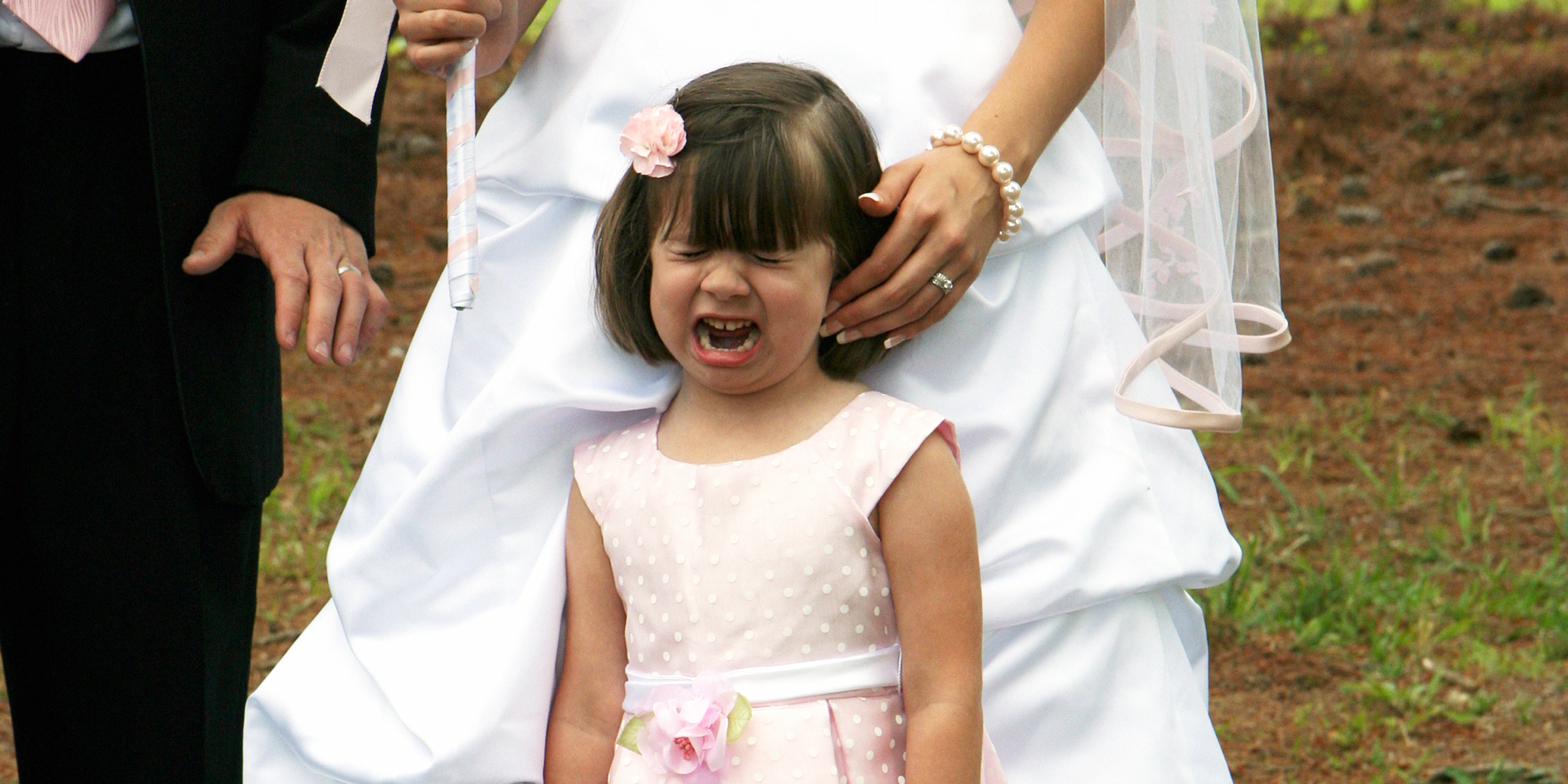 A little girl crying during a wedding | Source: Getty Images