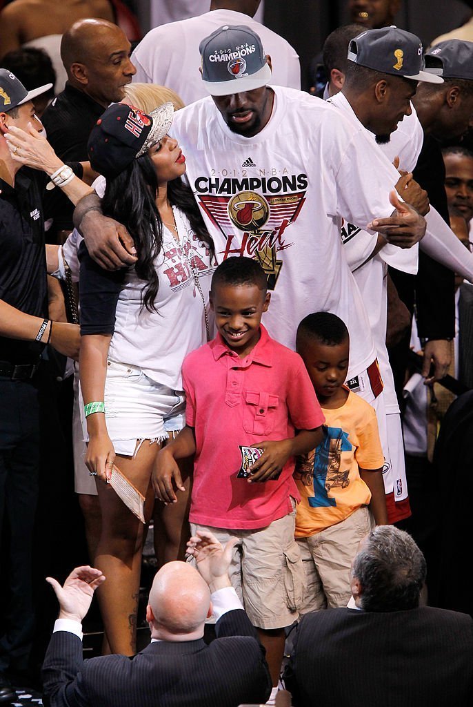 LeBron James #6 of the Miami Heat celebrates his wife Savannah Brinson and family after they Heat won 121-106 against the Oklahoma City Thunder in Game Five of the 2012 NBA Finals, Jun 21 2012 | Photo: Getty Images